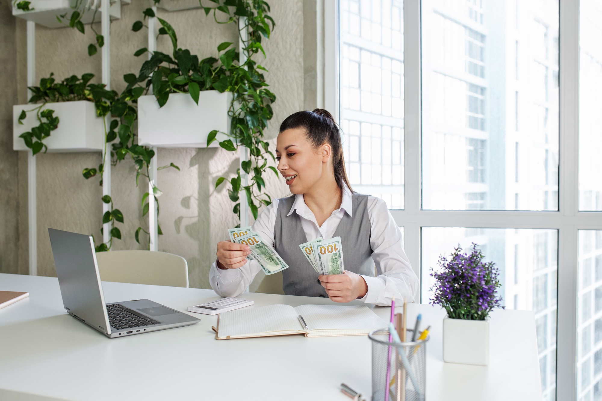 Success woman worker counting dollars at modern office. Achievement career concept