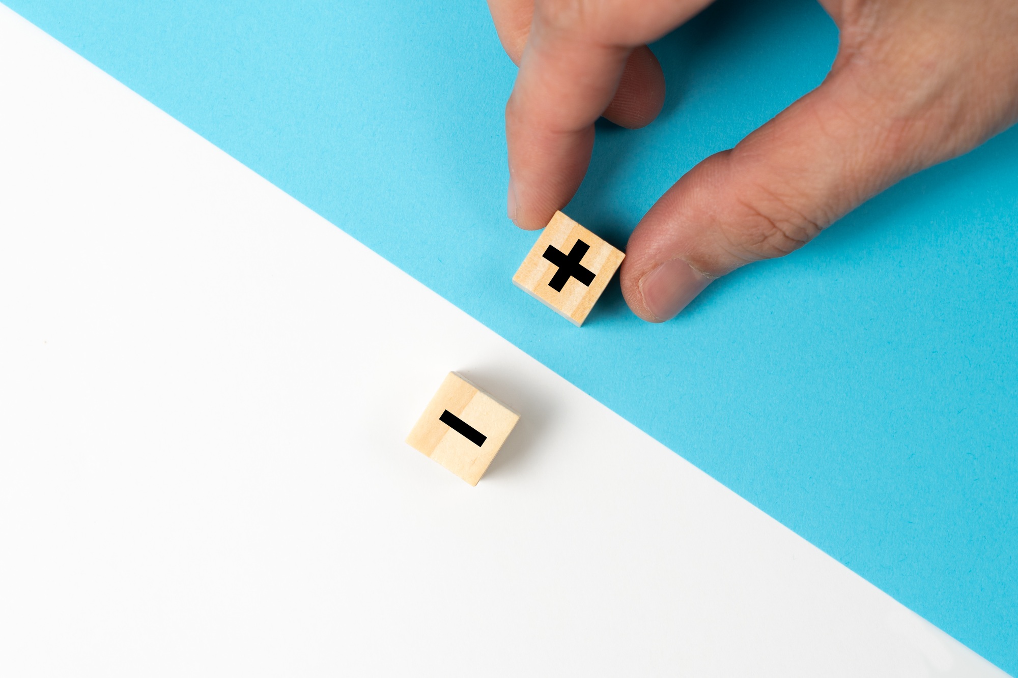 The concept of opposites or pros and cons using plus and minus signs