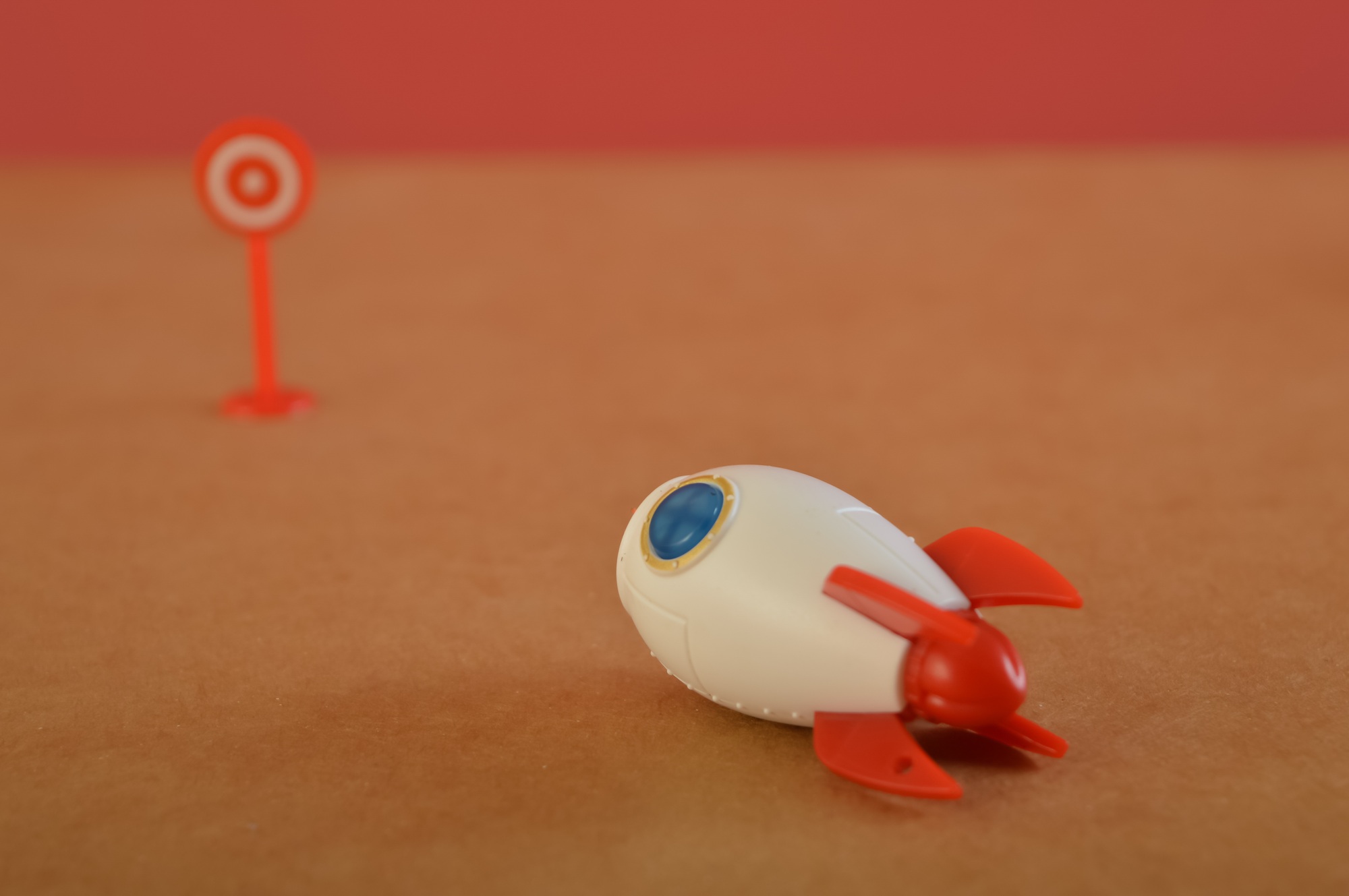 Toy rocket heading to the target. Concept of achieving your goal