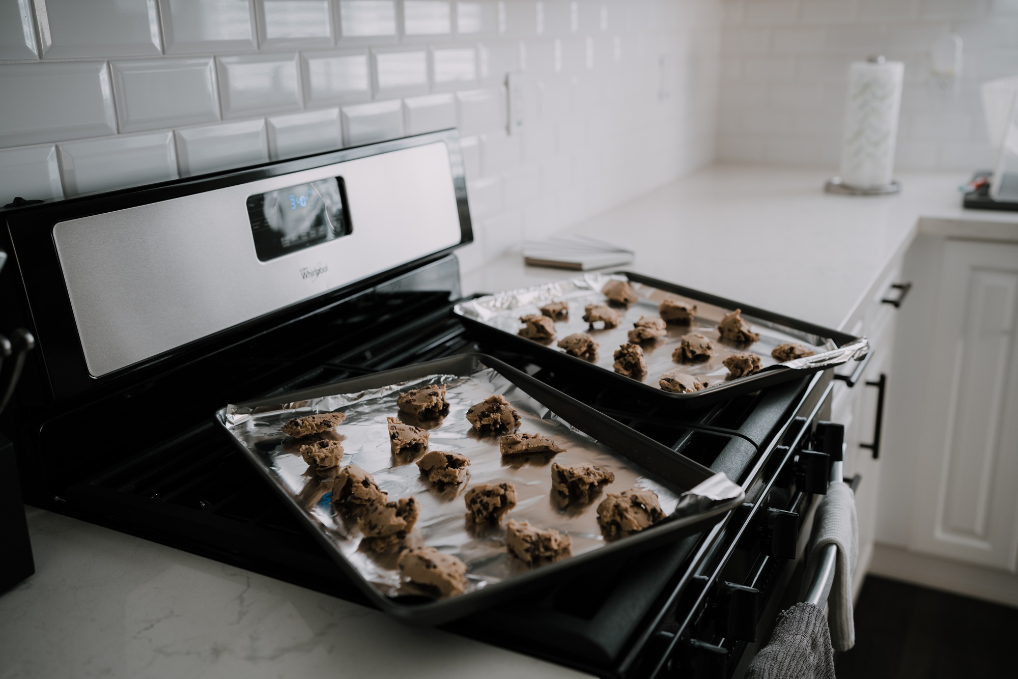 tray of cookie dough on oven in kitchen at home baking dessert sweets chocolate chip cookies cooking