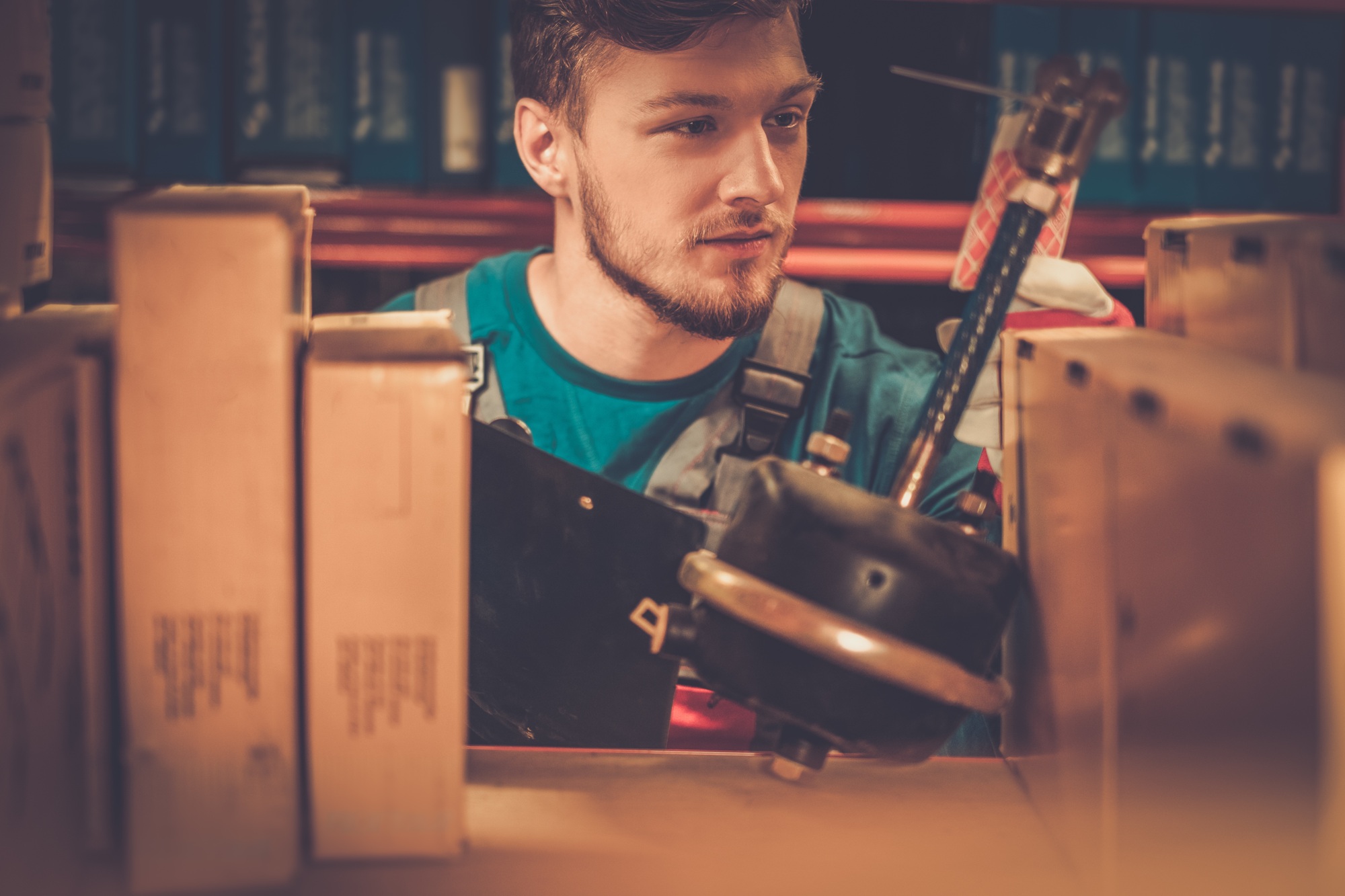 Worker on a automotive spare parts warehouse