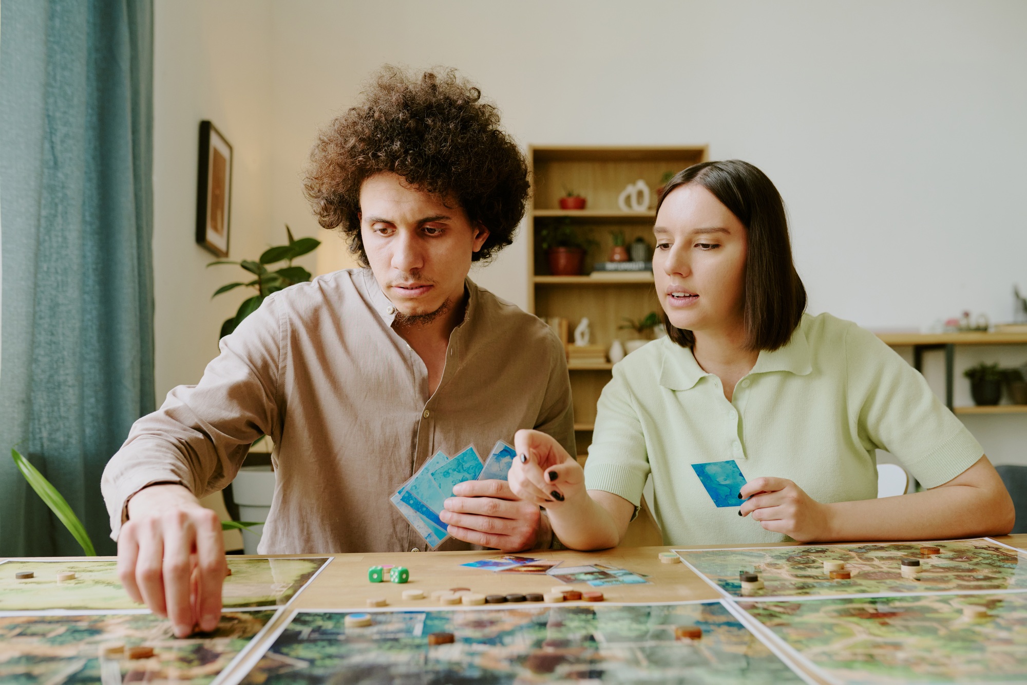 Young Couple Playing Fantasy Tabletop Game