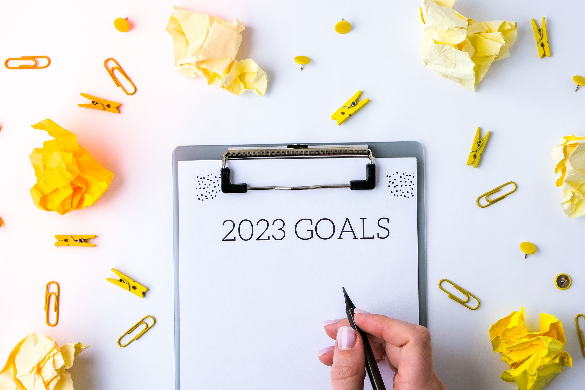 2023 goals. Yellow crumpled paper. Office supplies. Planning year concept. Copy space. Flat lay. Top