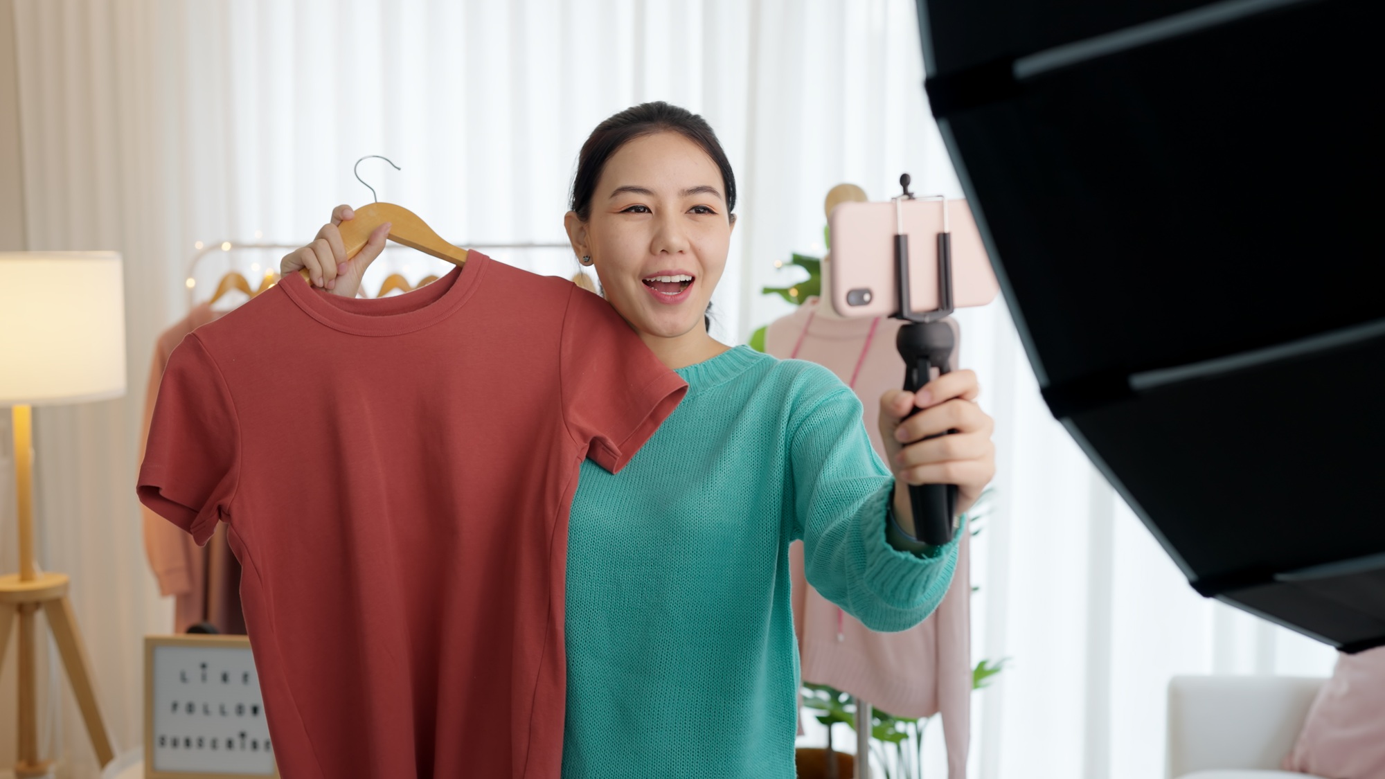 Asia vlogger woman influencer, SME retail store owner smile enjoy selling show live sale