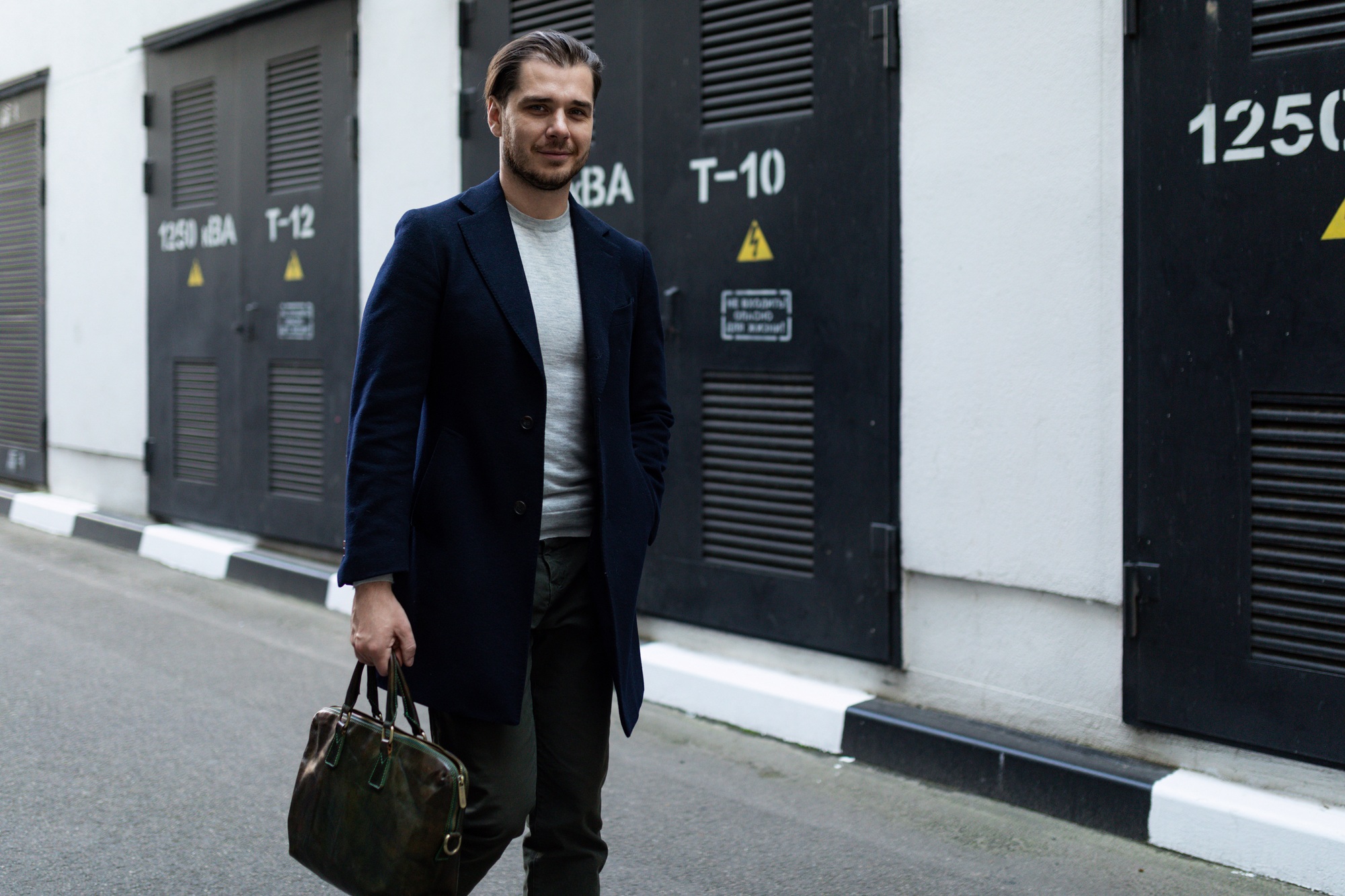 male sole proprietor heading to work with a briefcase in his hands.