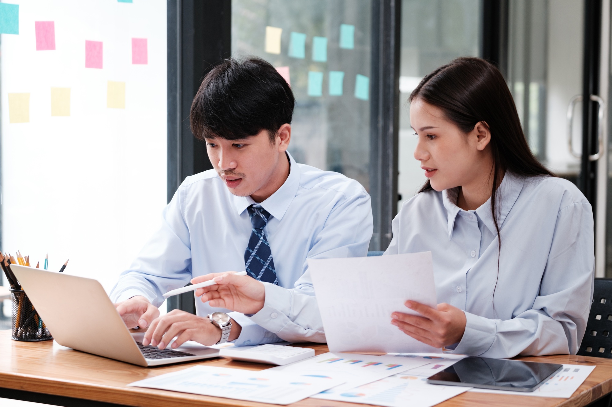 Business Team Engaged in Strategic Planning at Desk