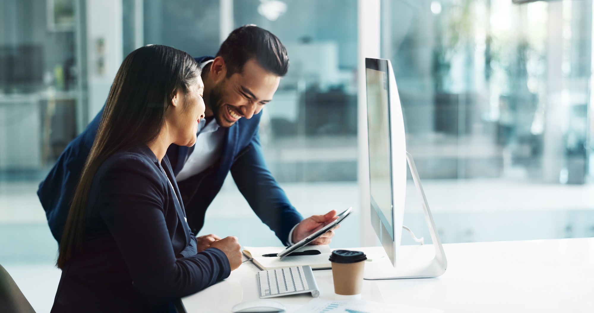 Business people, teamwork and planning on computer, tablet and comparison in multimedia research or