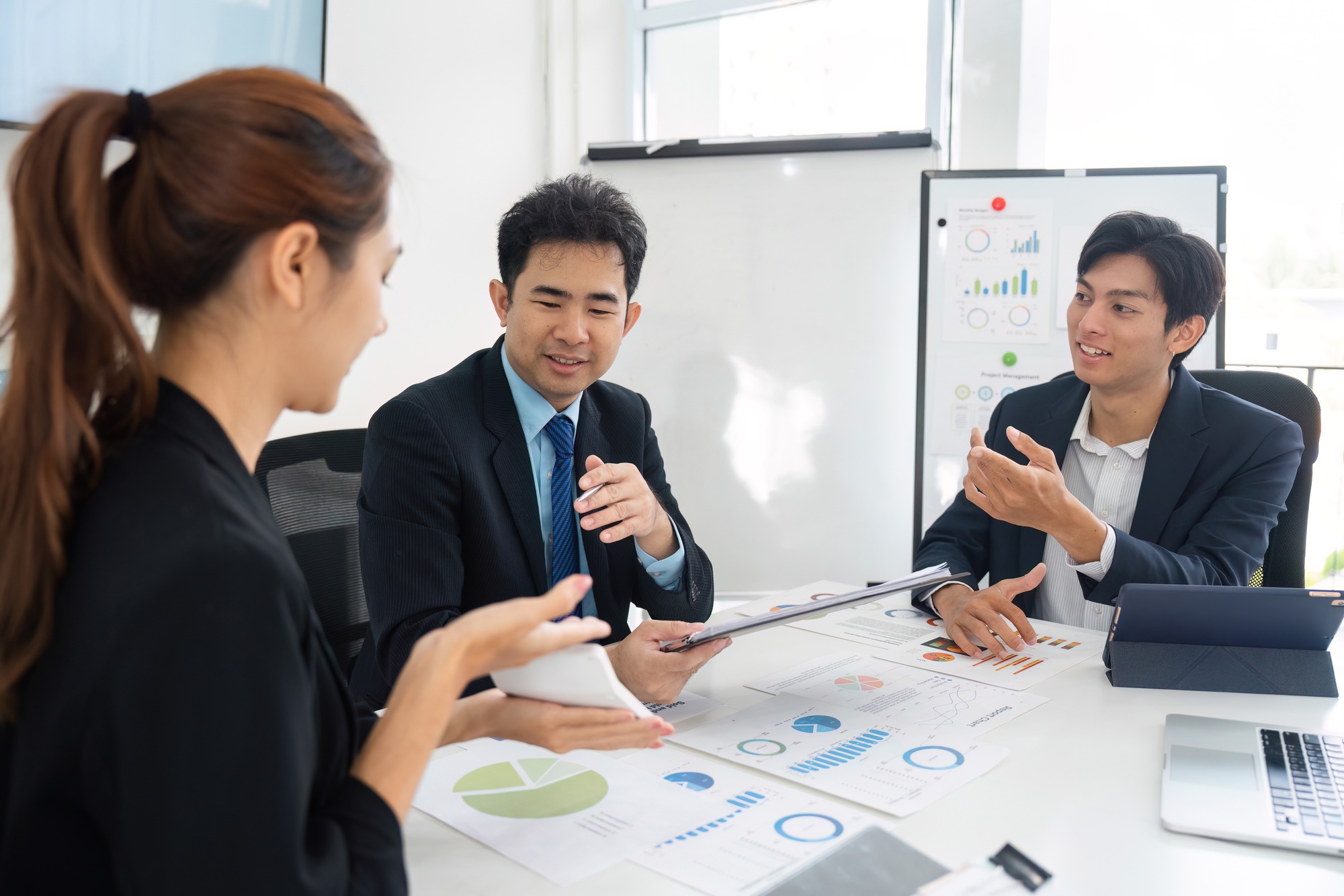 A group discussing data-driven decisions in a modern office.