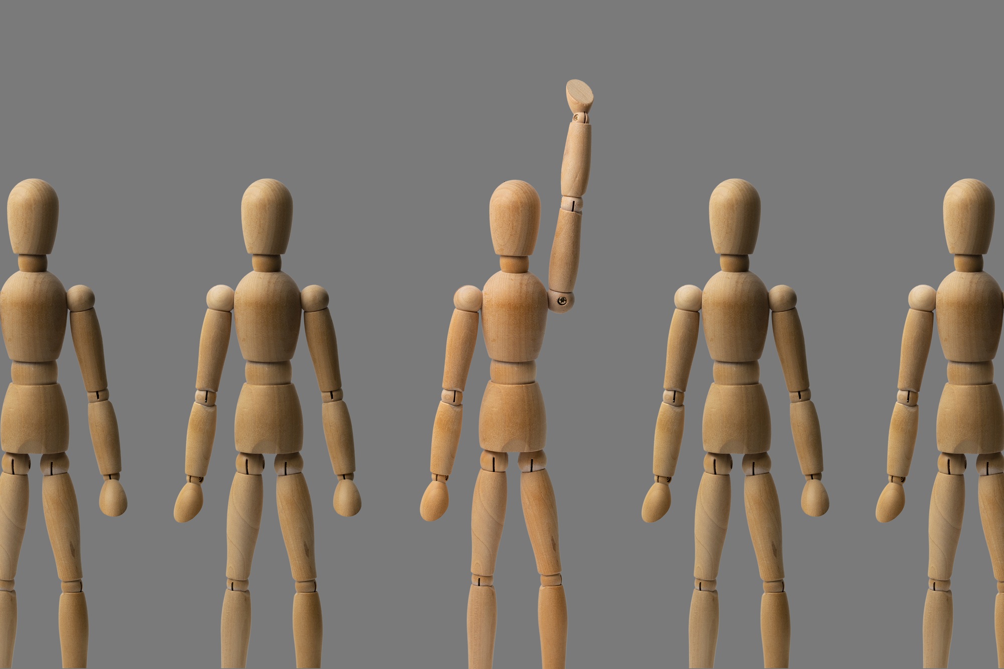 a leadership and business concept, wooden dolls with one unique person