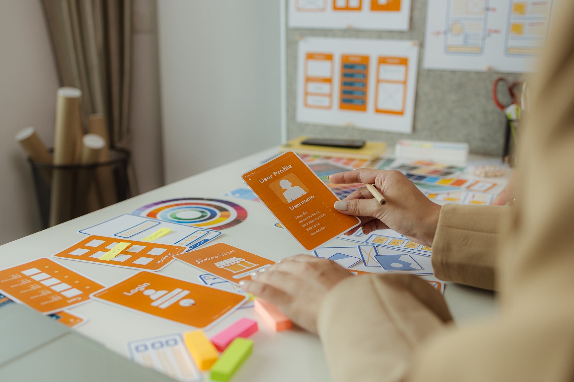 A team of web developers discusses how to best organize a website layout.
