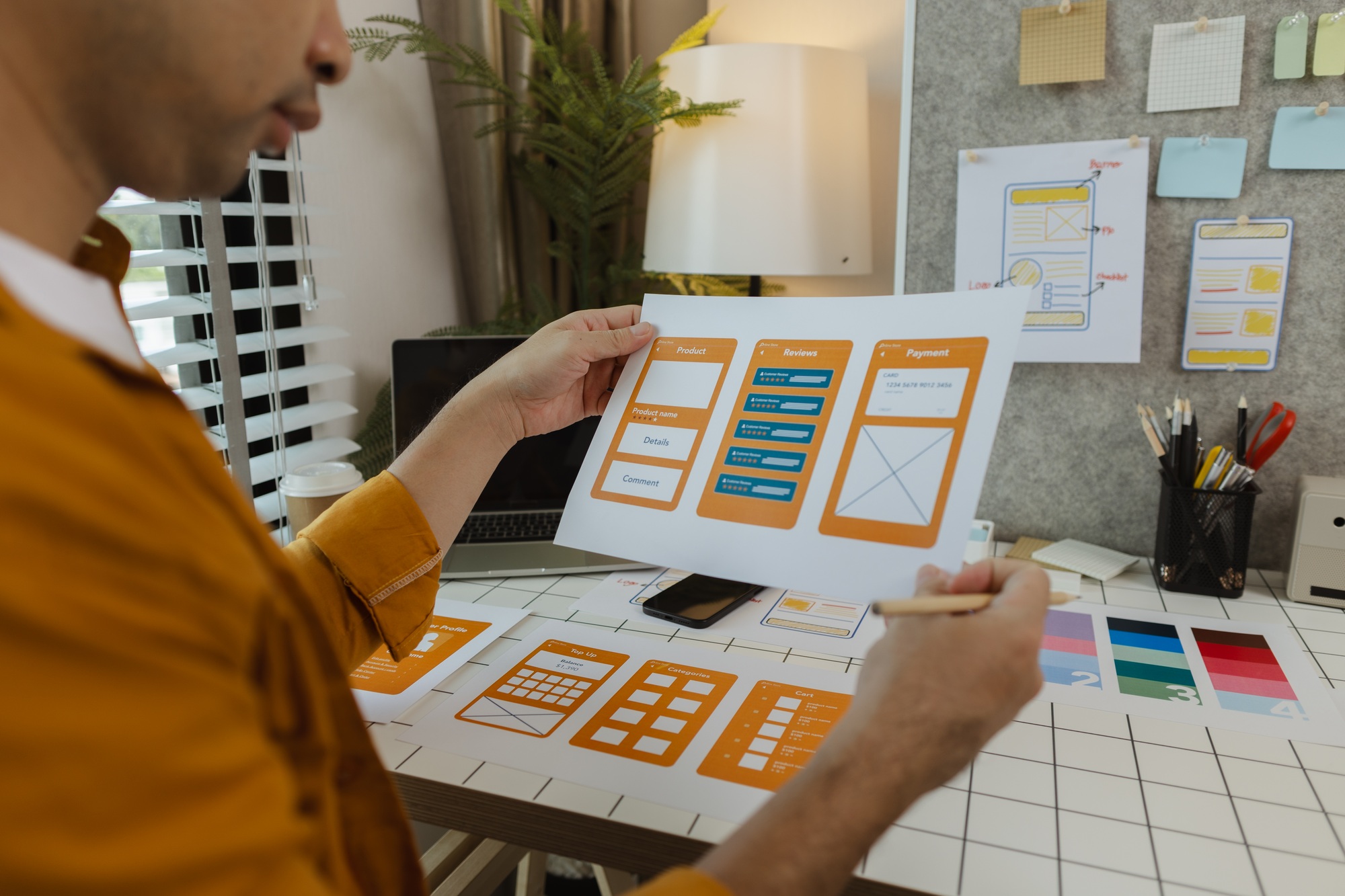 A web developer, as a User Experience and User Interface Officer, is designing beautiful and easy-to