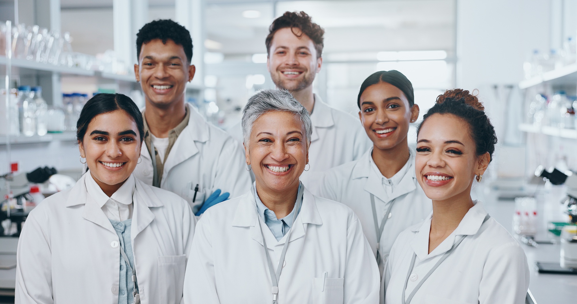 About us, people and happy as scientist in lab for medical research on internship program. Female l