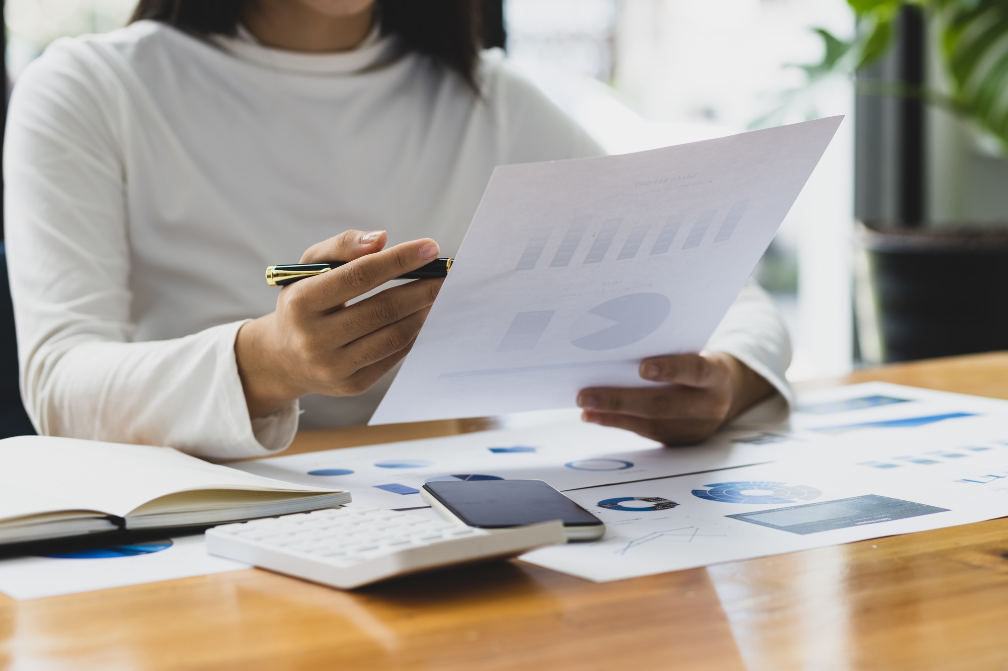 Accountant working on consolidated financial report consultant auditing finance data.