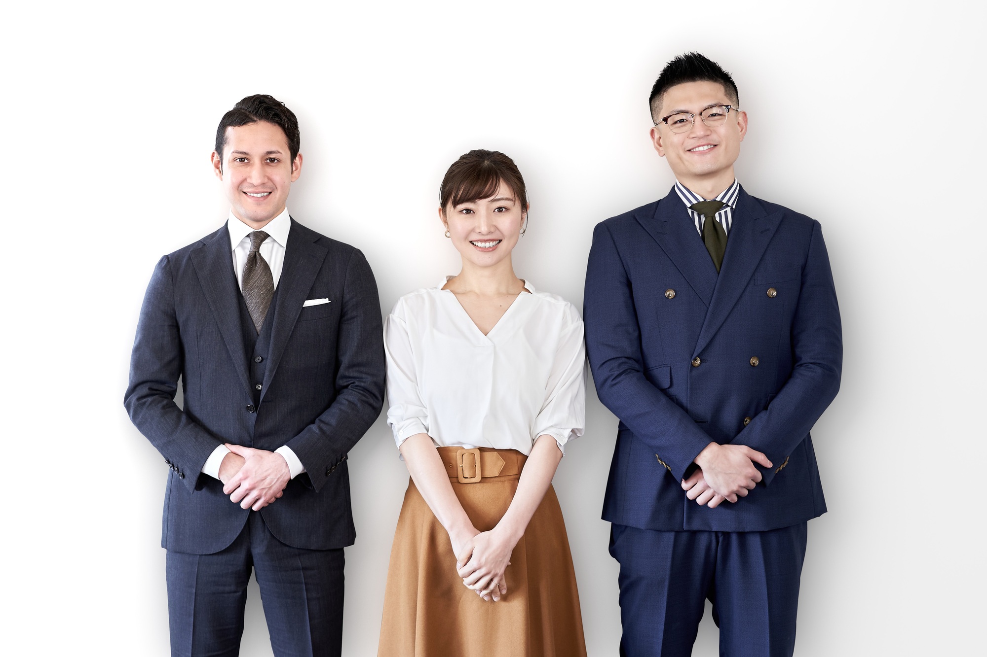 Asian and Latin business people standing with a smile