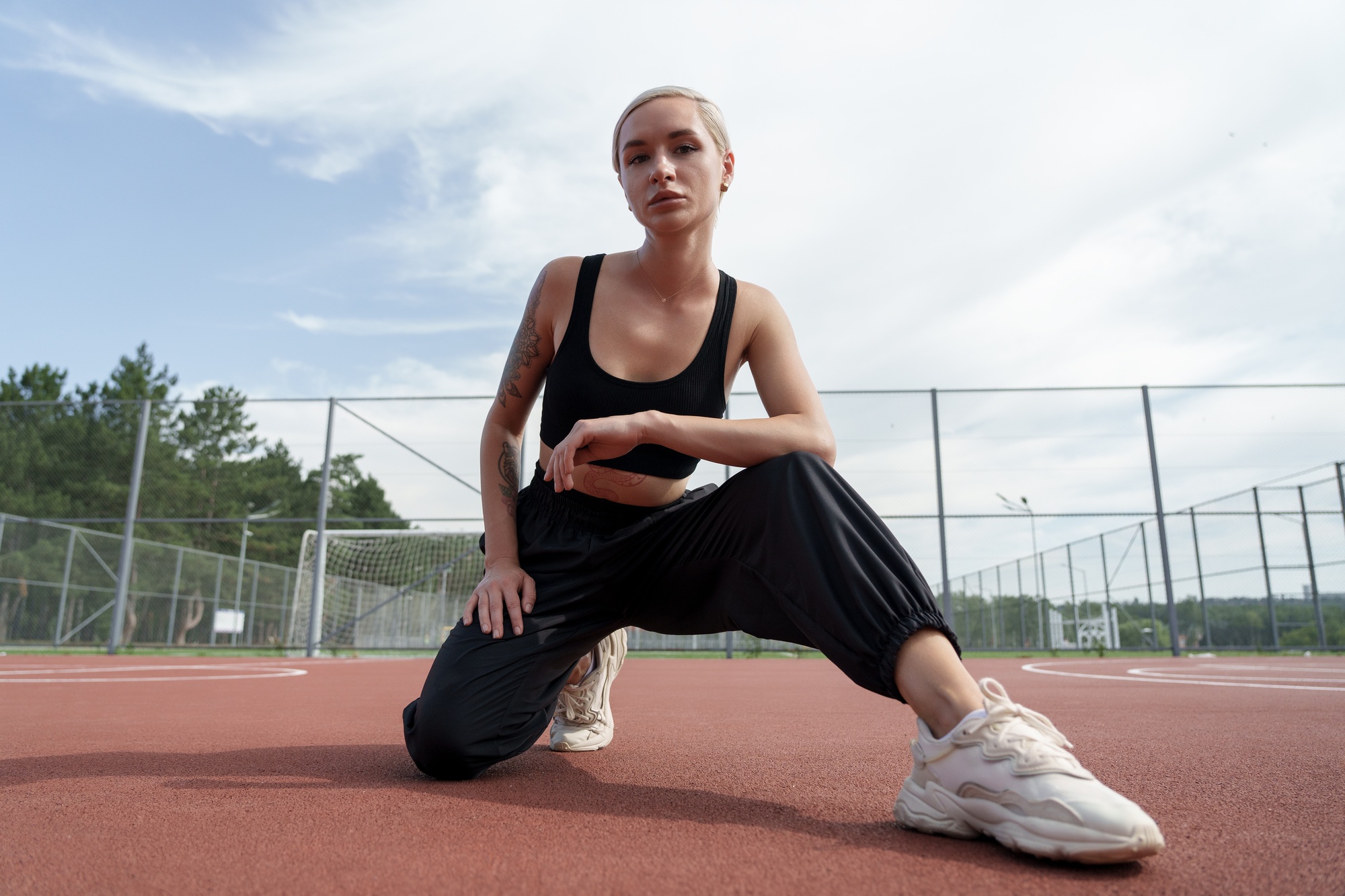 Athletic woman taking a break on the running track