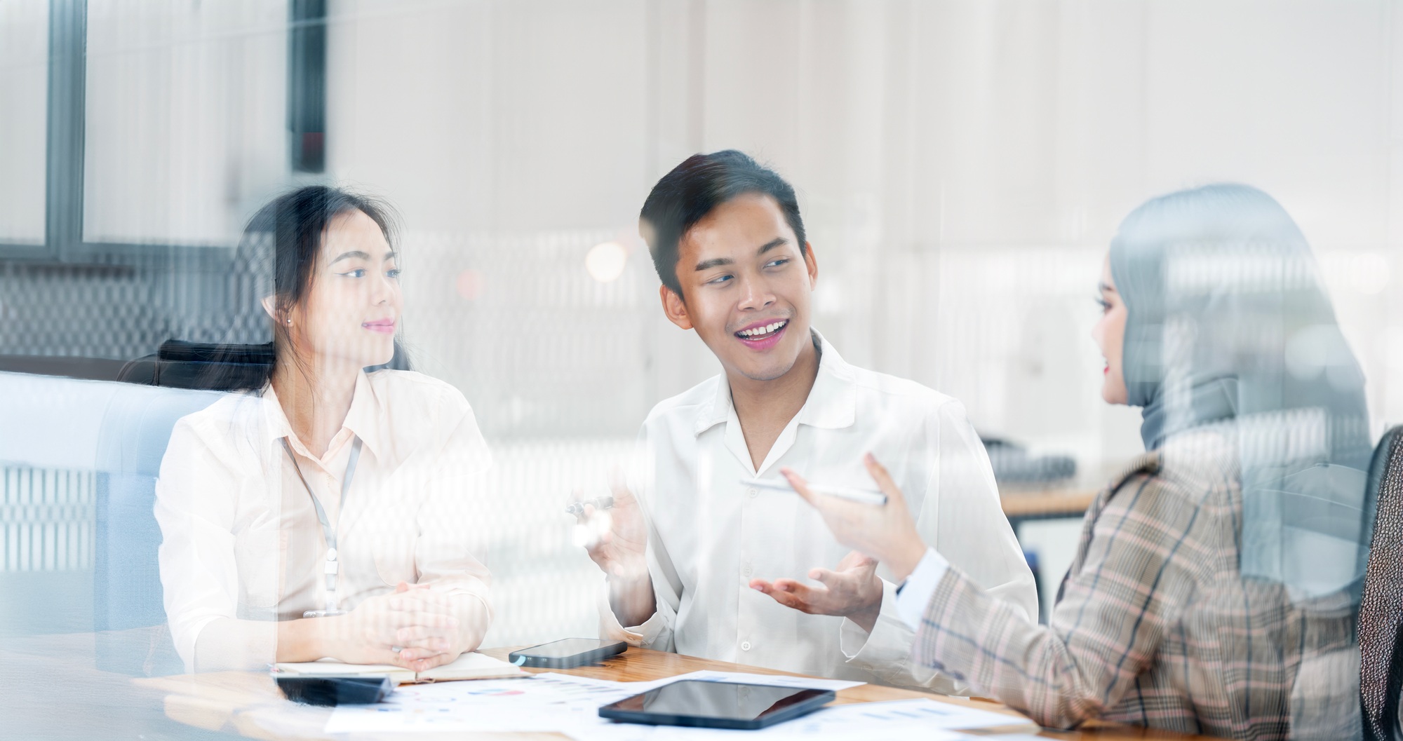 Attractive employee brainstorm and meeting as team, plan and discuss project in workplace.