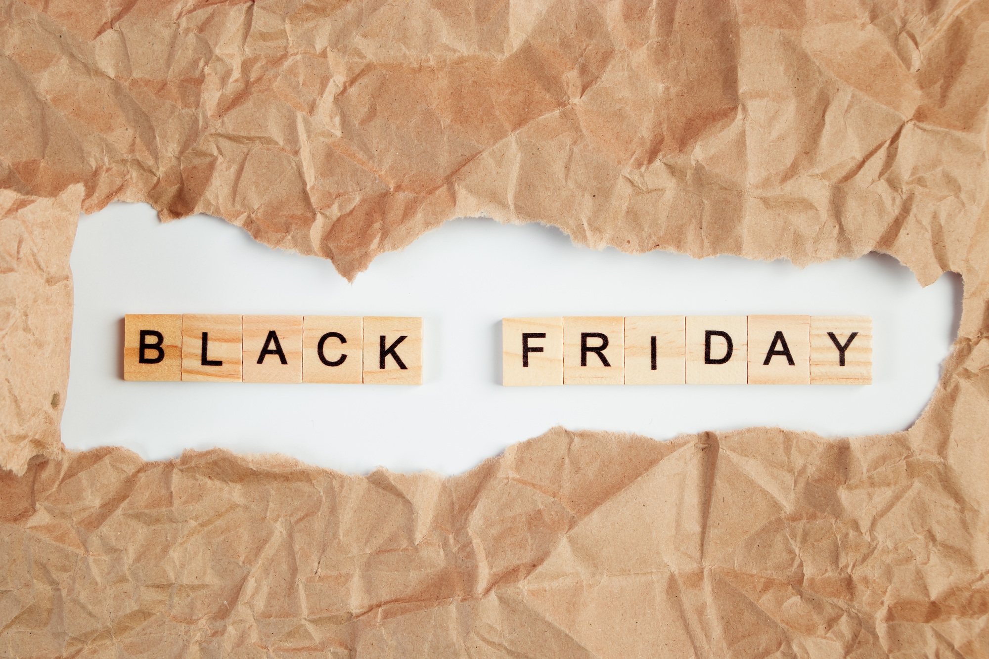 Black Friday sale. Text in torn craft paper.