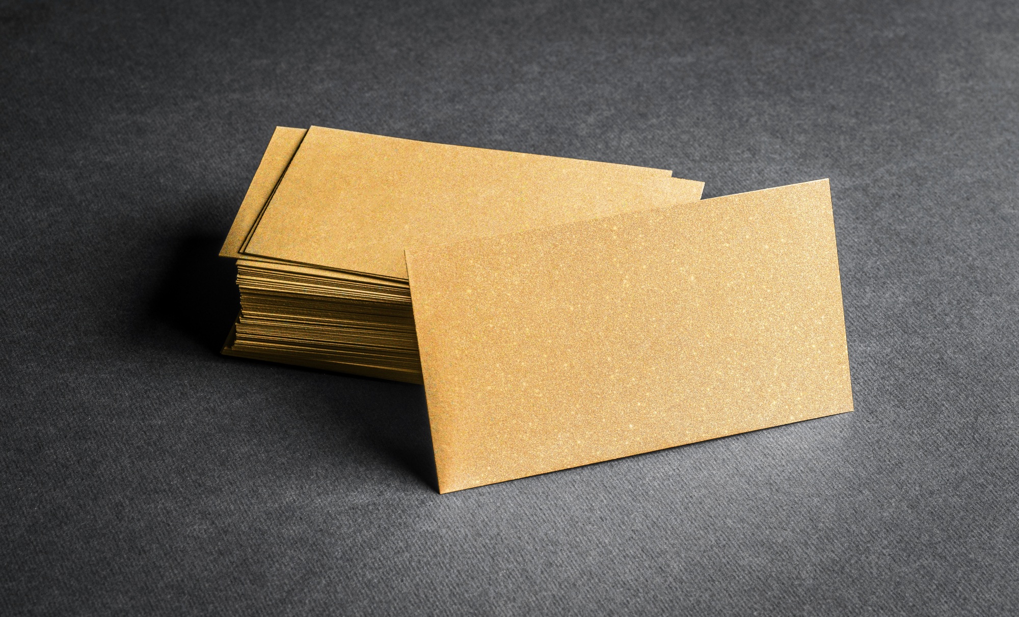 Blank golden business card on grey background