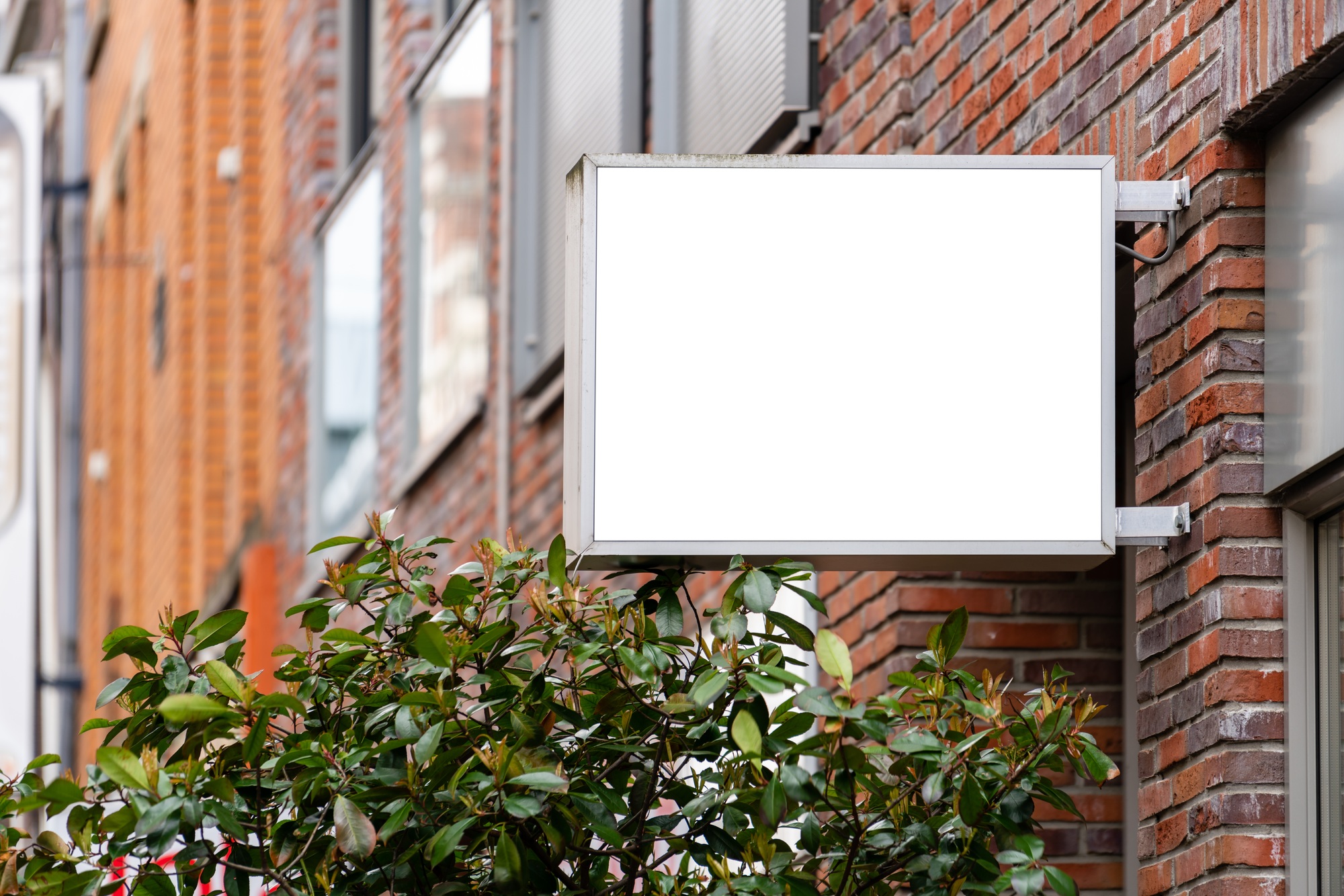 Blank square store signboard mockup street sign with empty circular shop logo template board.