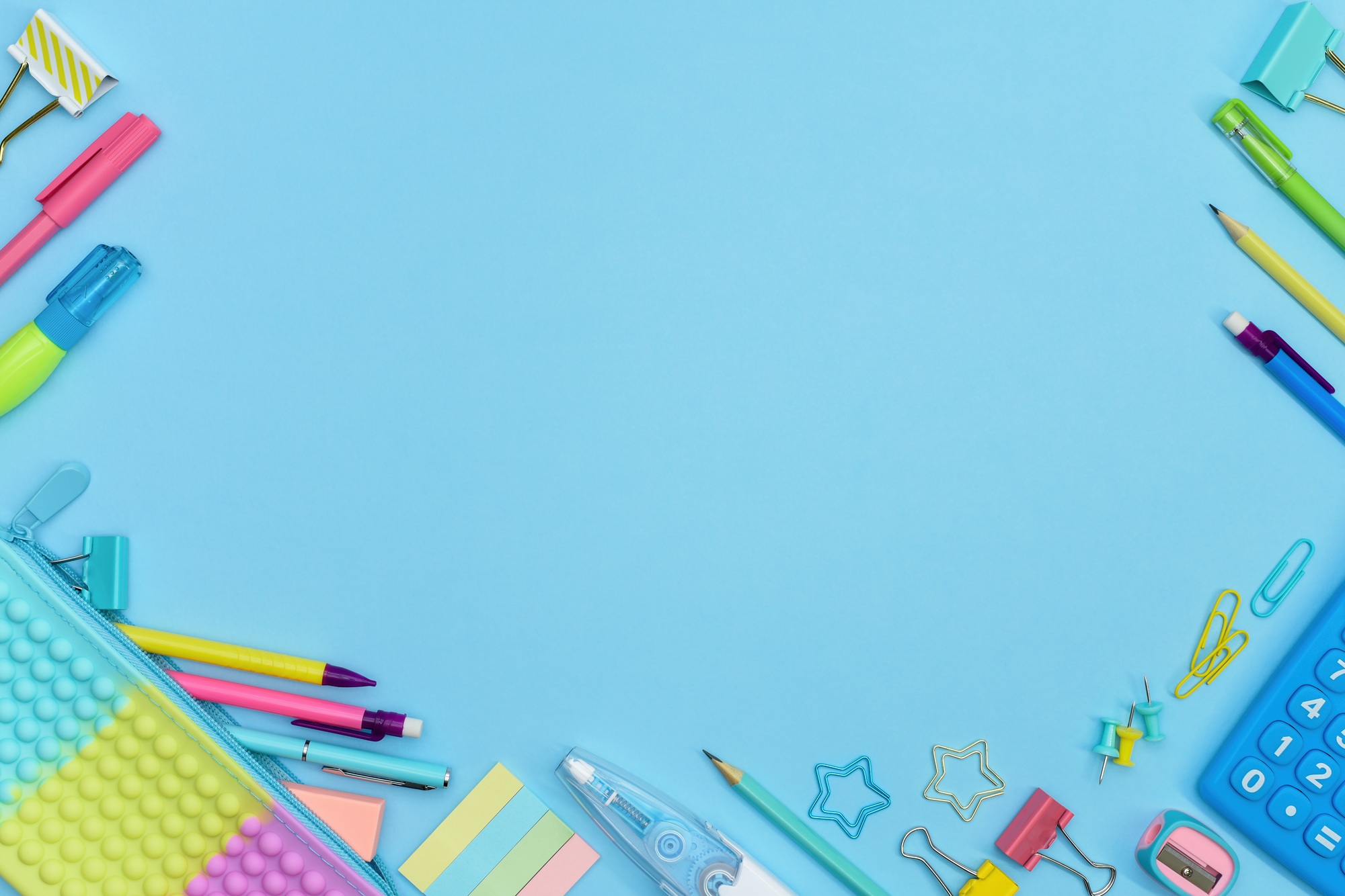 Borders crafted from brightly colored school and office supplies.