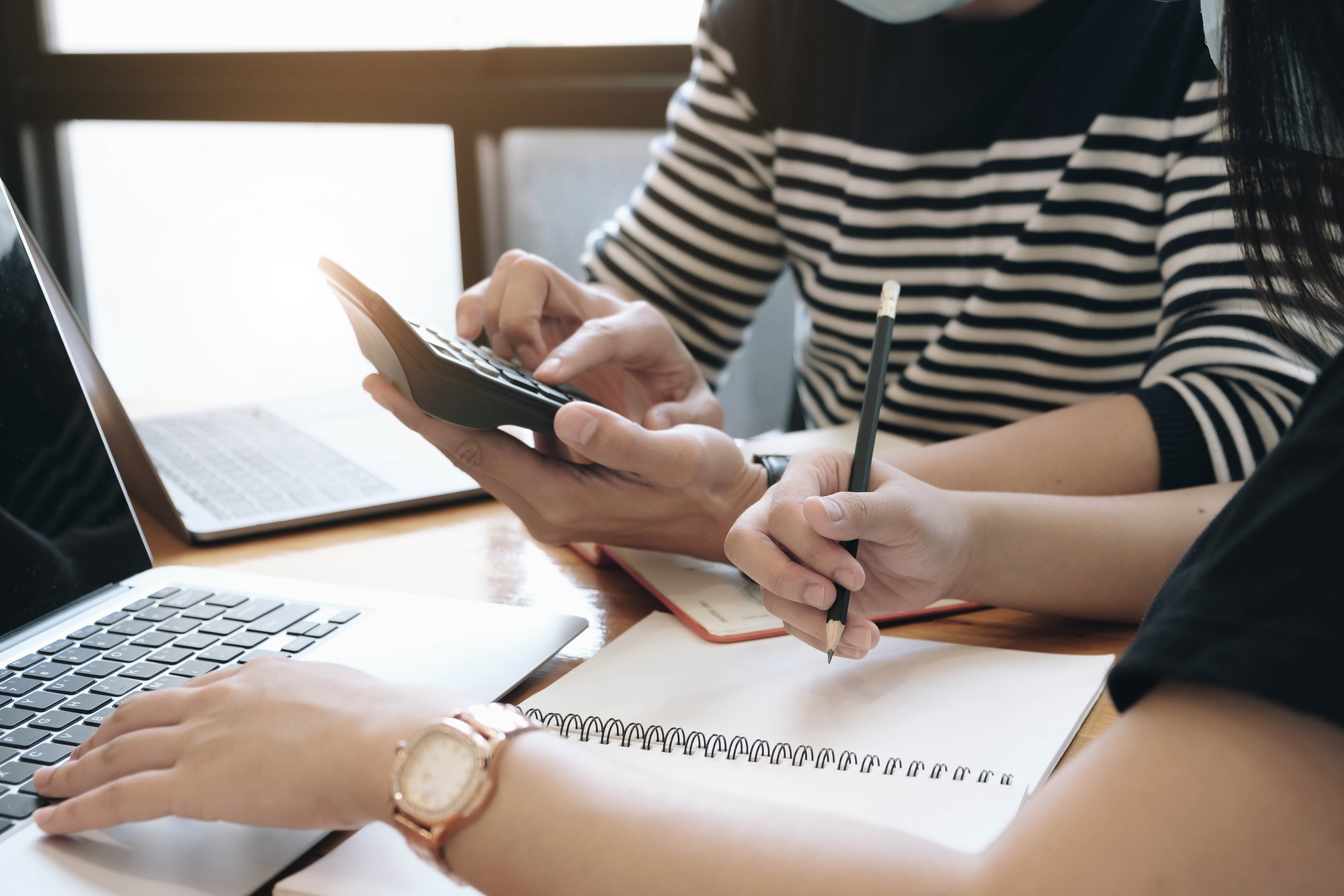 Business accounting concept, Business man using calculator with computer laptop, budget and loan