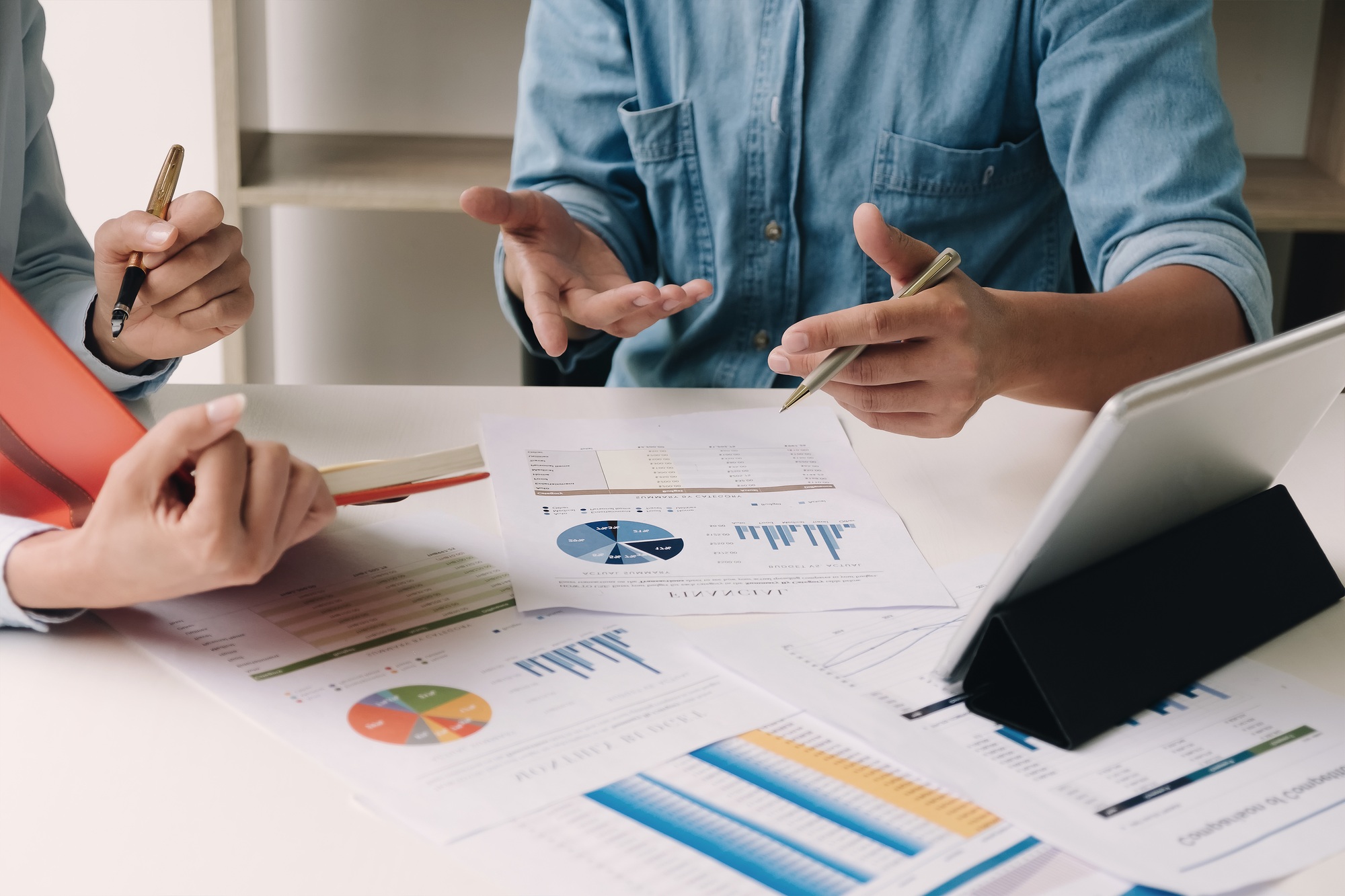 business consulting or finance budget plan, business advisor holding pen pointing to explain method