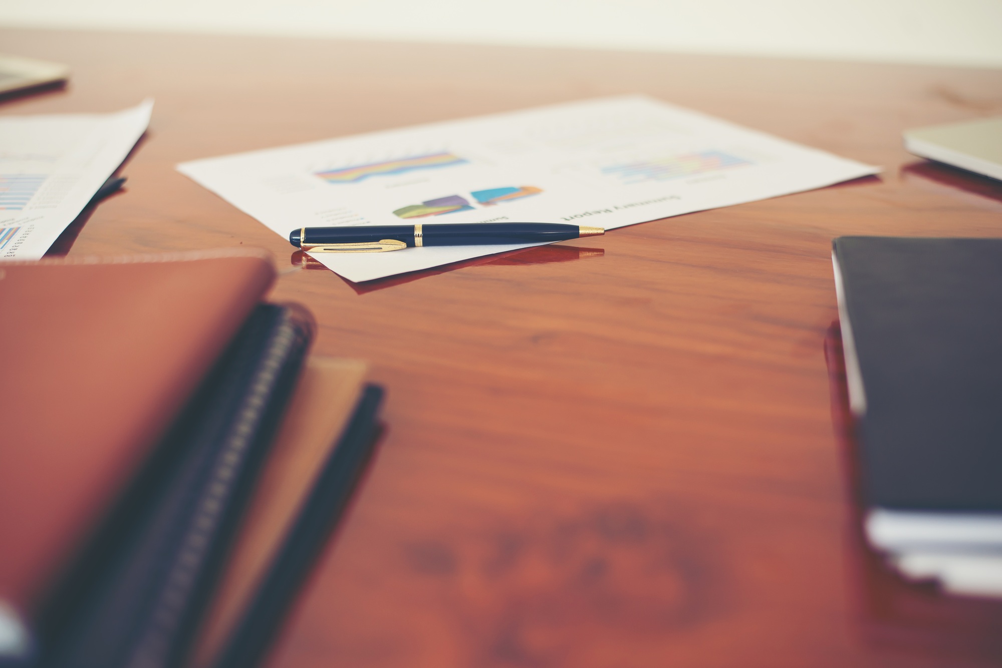 business documents with charts growth,and pen,workplace business.