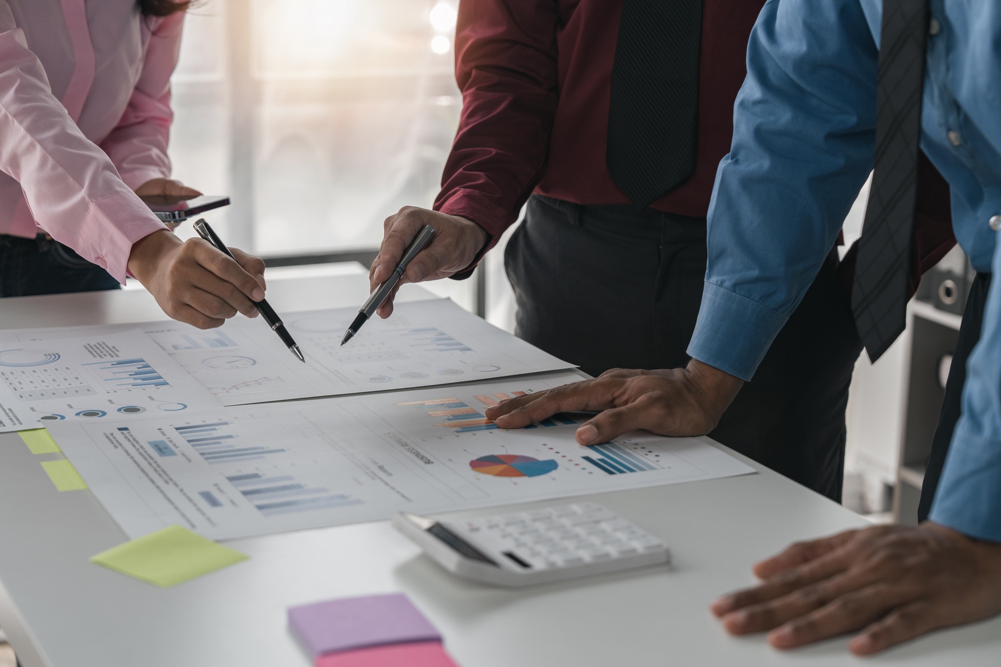 business meeting in office planning, goals or mission at desk with strategy and financial analysis