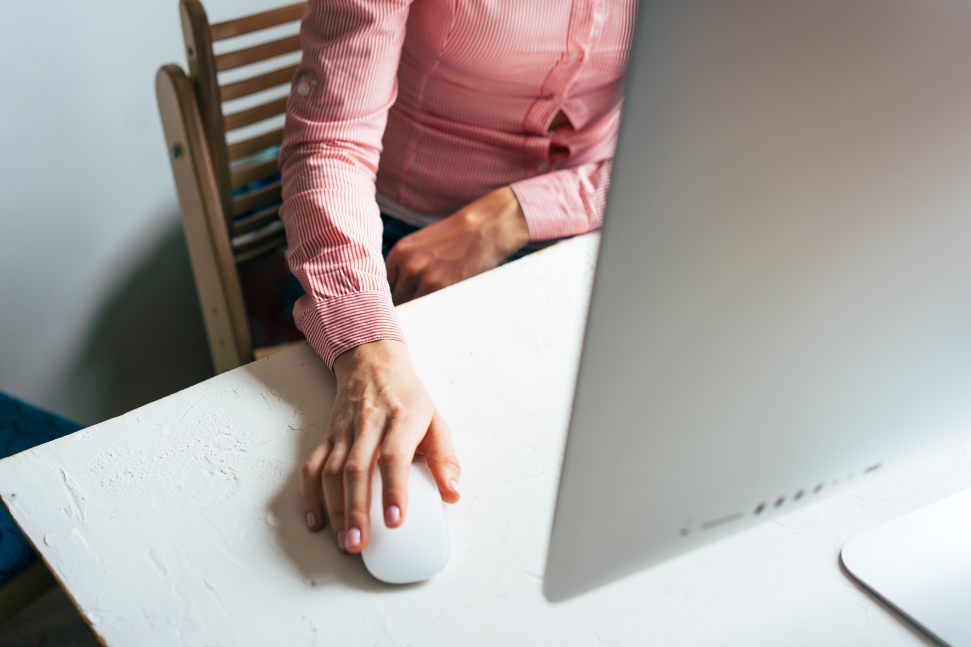 Business operation at the computer. Work from home. Close-up of a hand on a mouse
