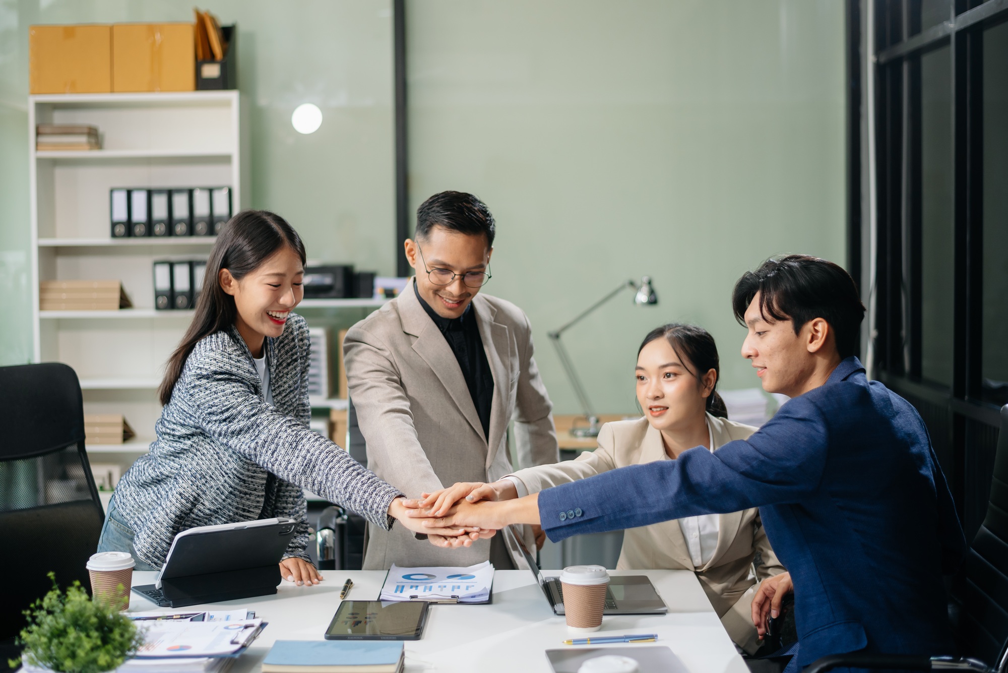 Business partnership handshake concept.Photo Multiracial team coworkers handshaking process.