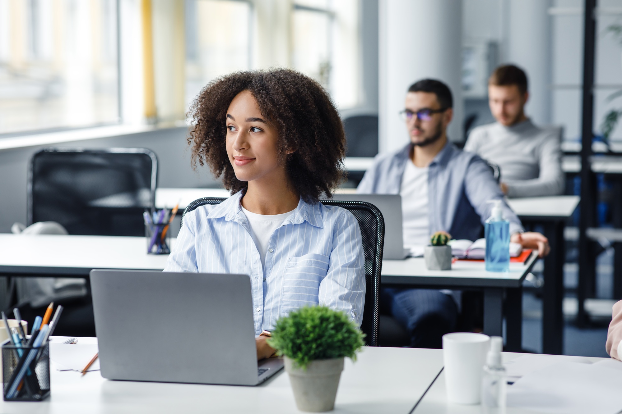 Business process and management ideas creation. African american woman looking at window at