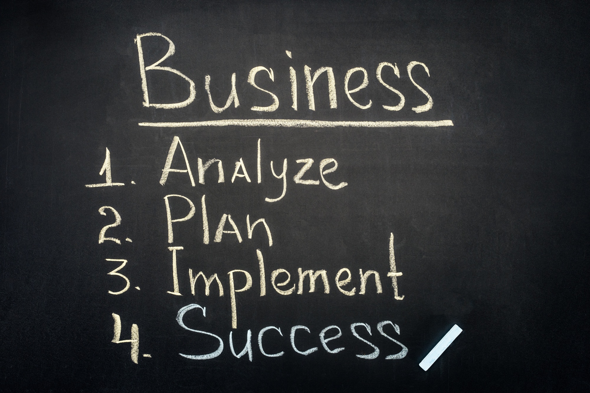 Business process stages inscription on dark chalkboard