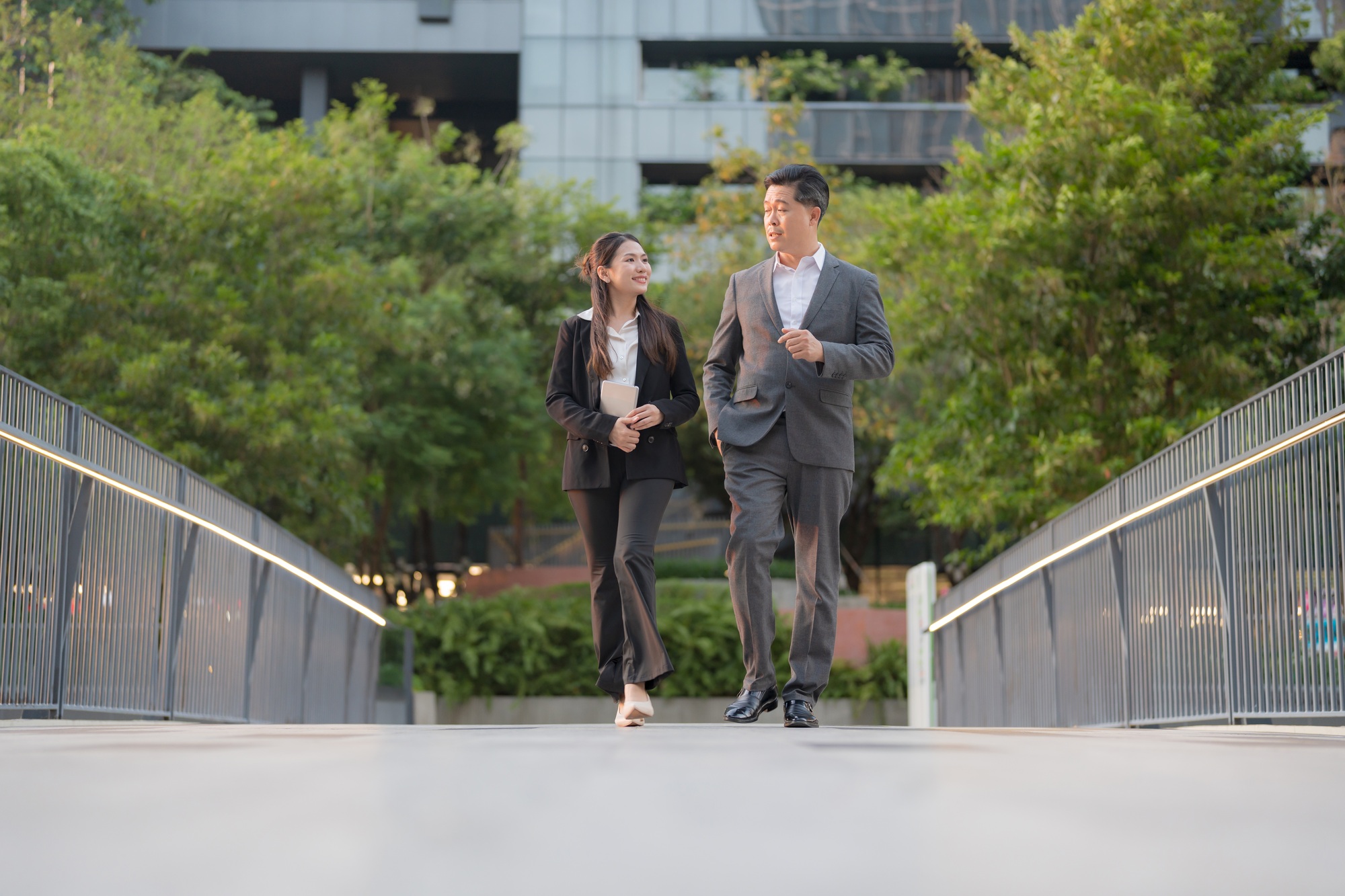 Business professionals walking in modern urban setting