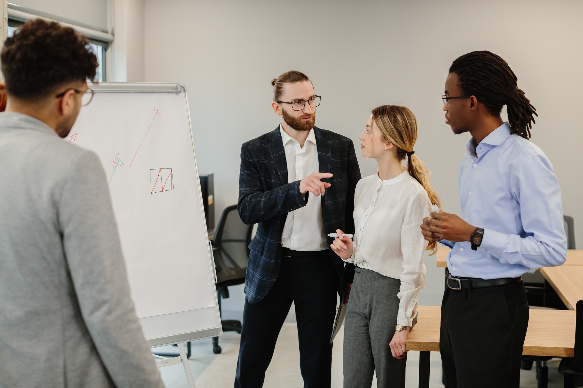 Business team analyzing growth charts during meeting in office