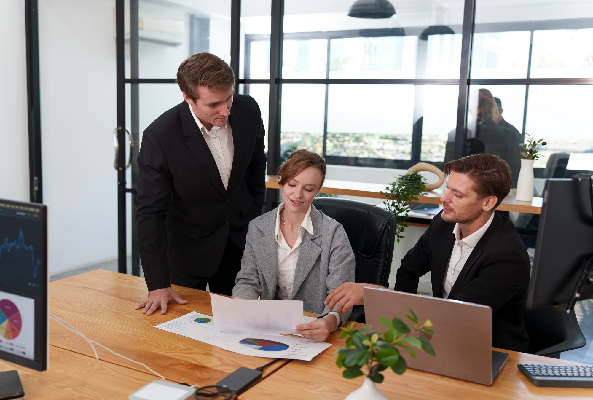 Business team collaborating in a modern office during a strategic meeting