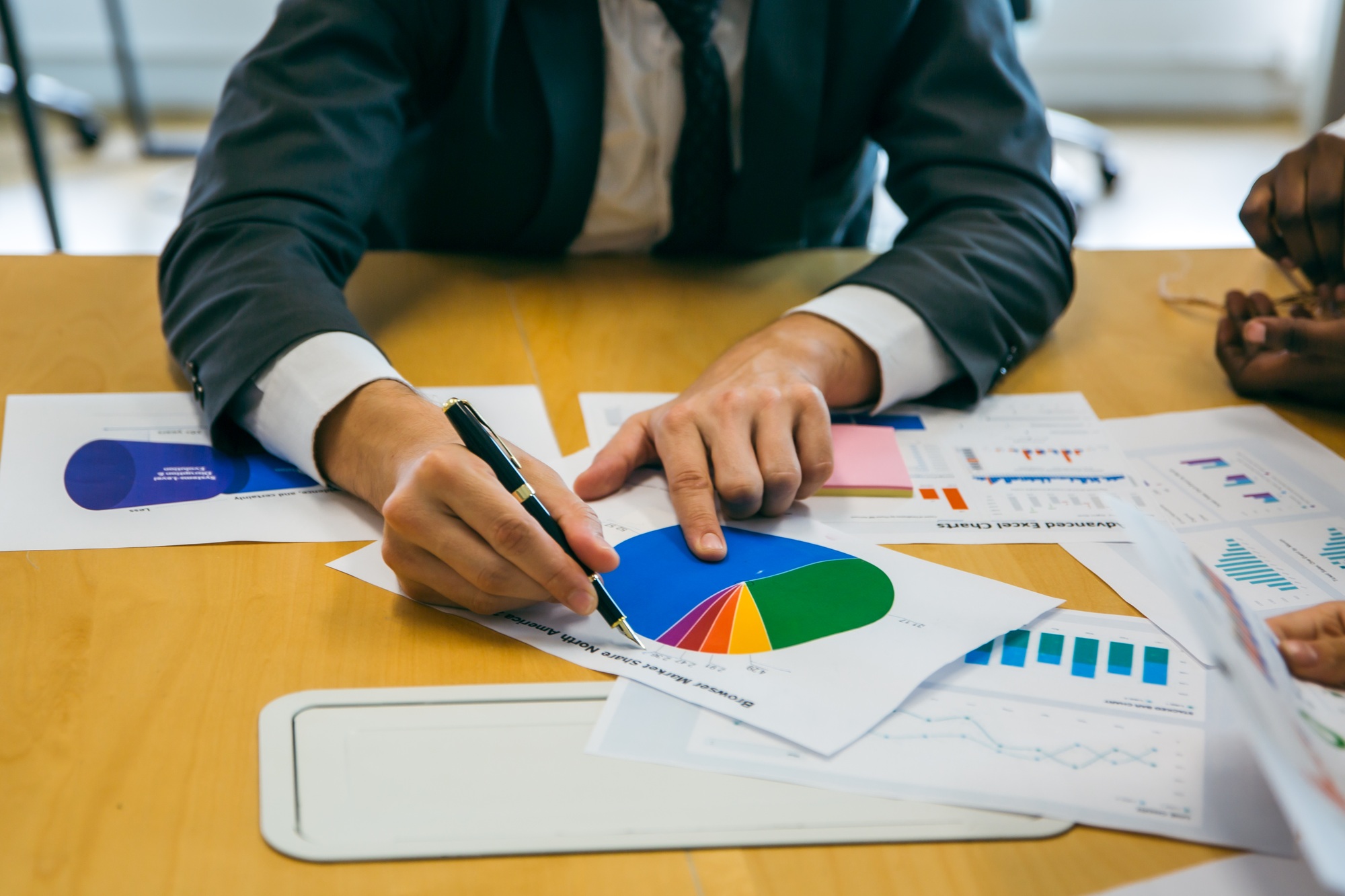 business team meeting with stats and review graphs of company target, goals or market