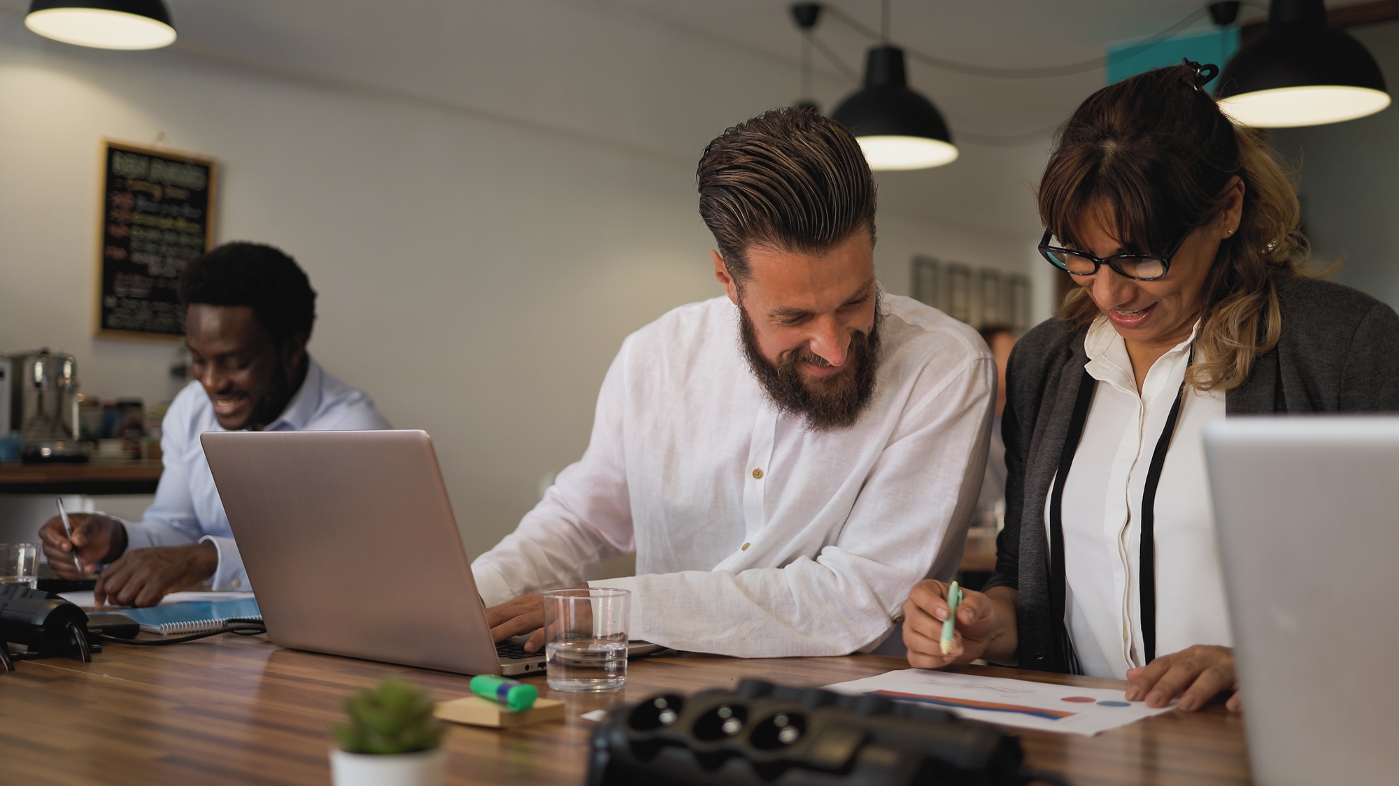 Business team of diverse people doing strategic planning work inside modern office