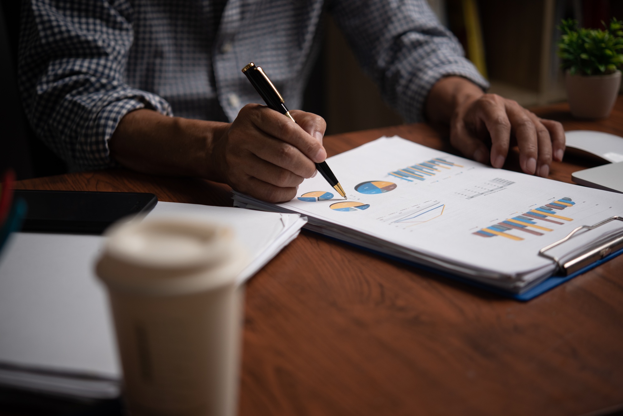 Businessman analyzing business planning, strategy, marketing and financial reports