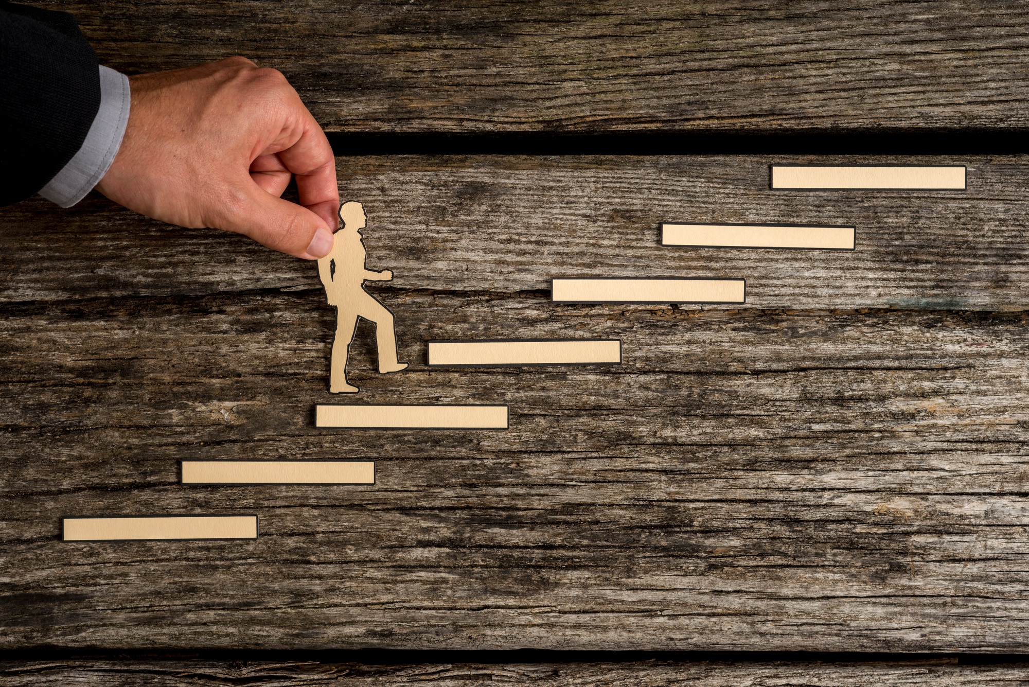 Businessman climbing the steps to success
