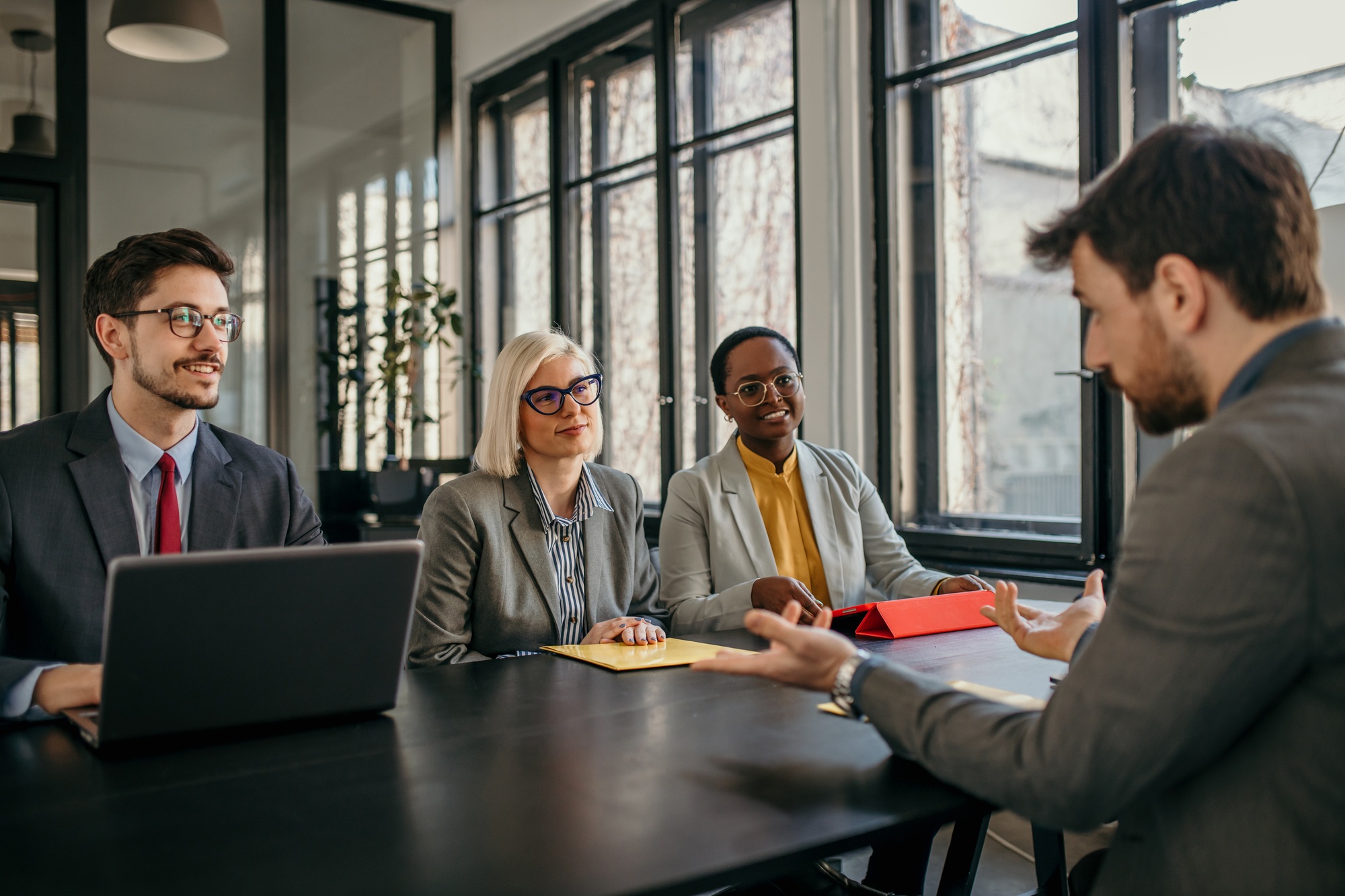 Businessman explaining strategy to colleagues during office meeting