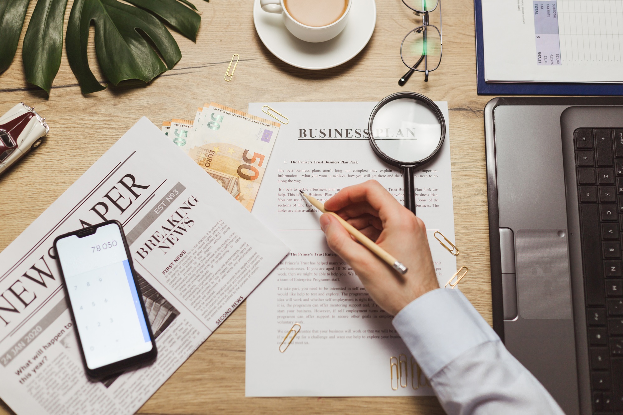 businessman hand checking marketing document business plan