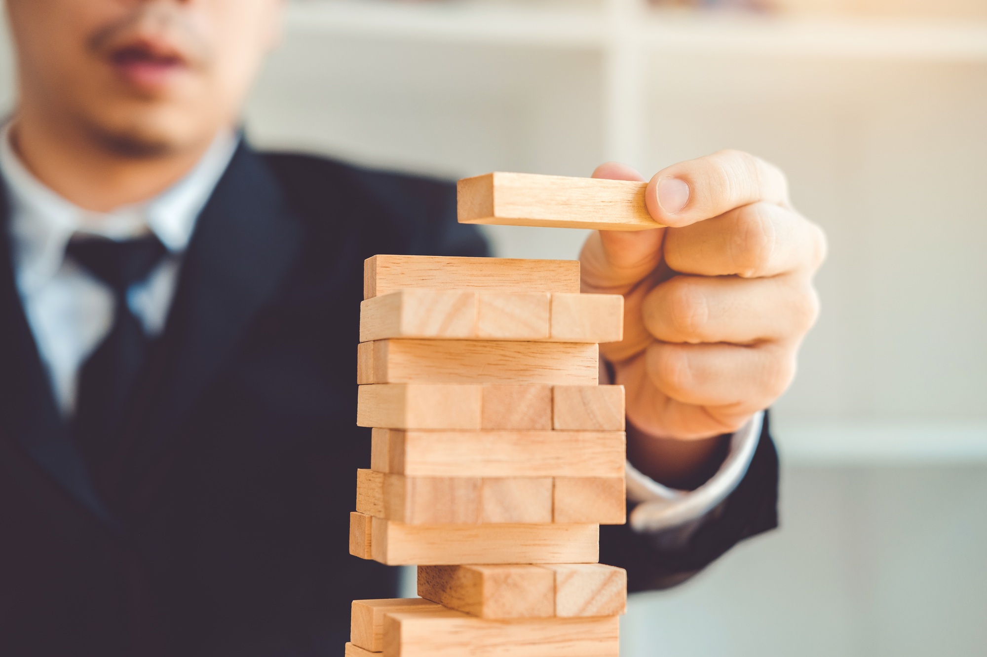 Businessman plan and strategy in business Domino Effect Problem Solving