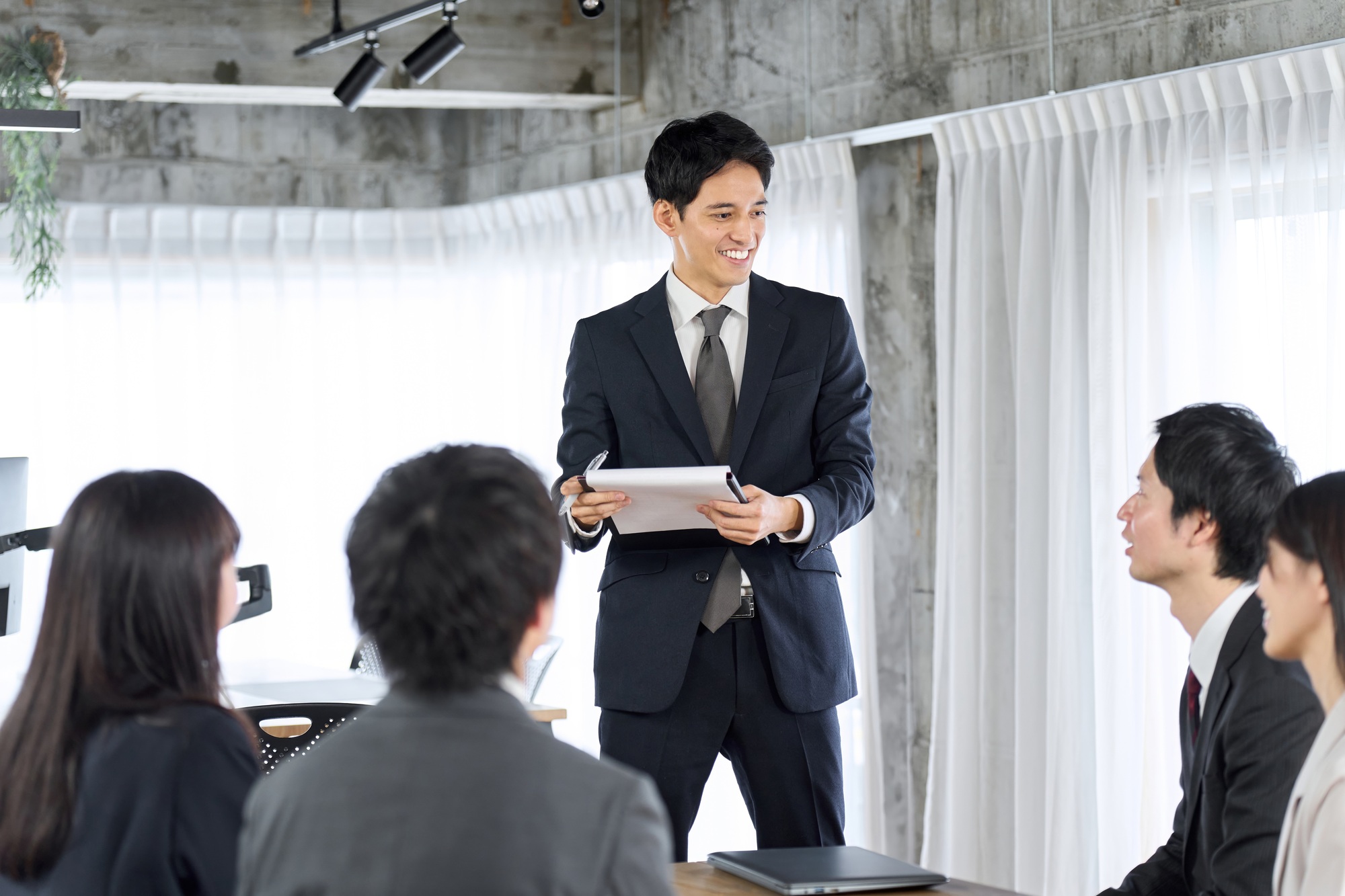 Businessman training new employees in the office