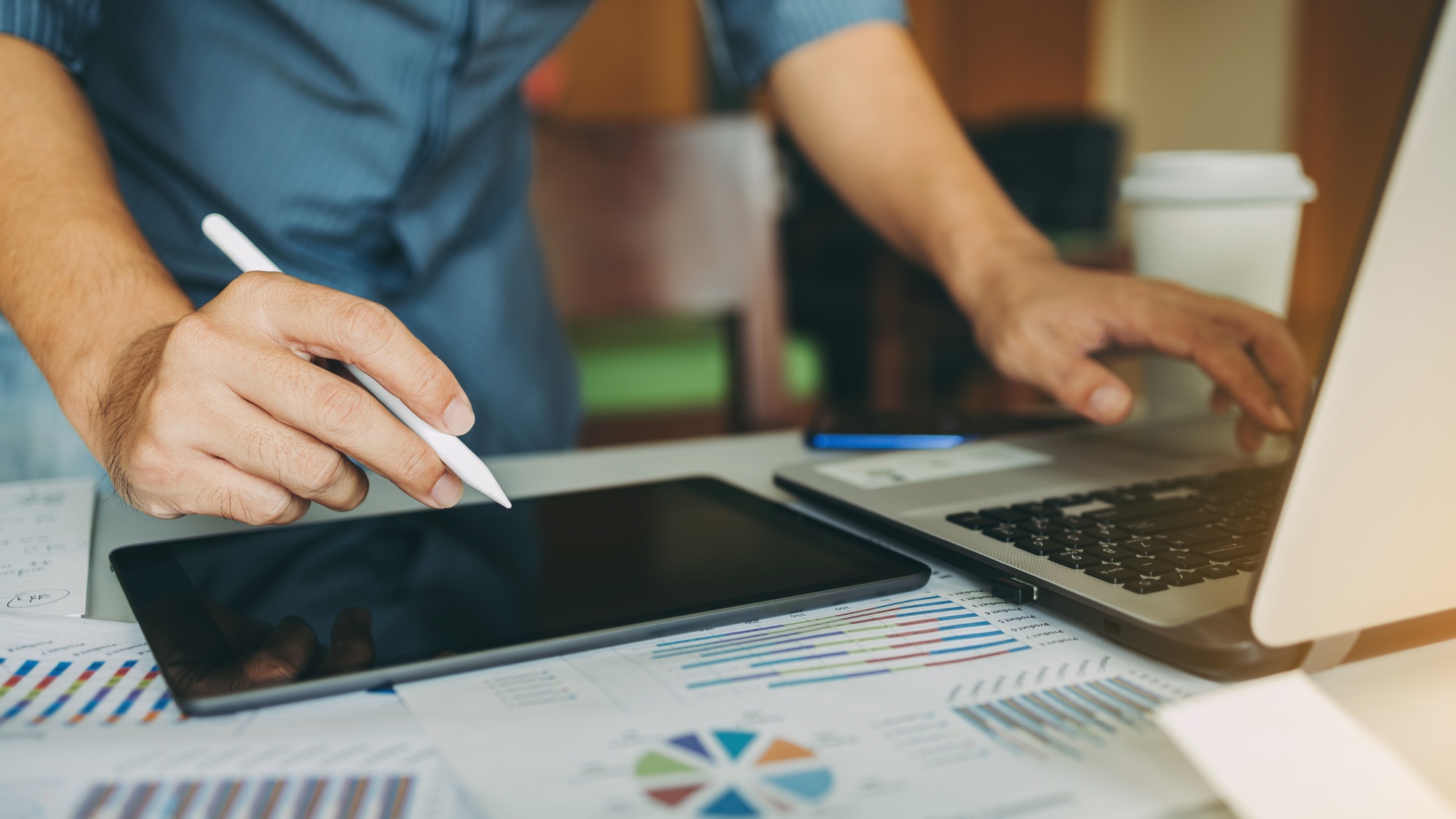 Businessman working with data analysis papers for business marketing plan