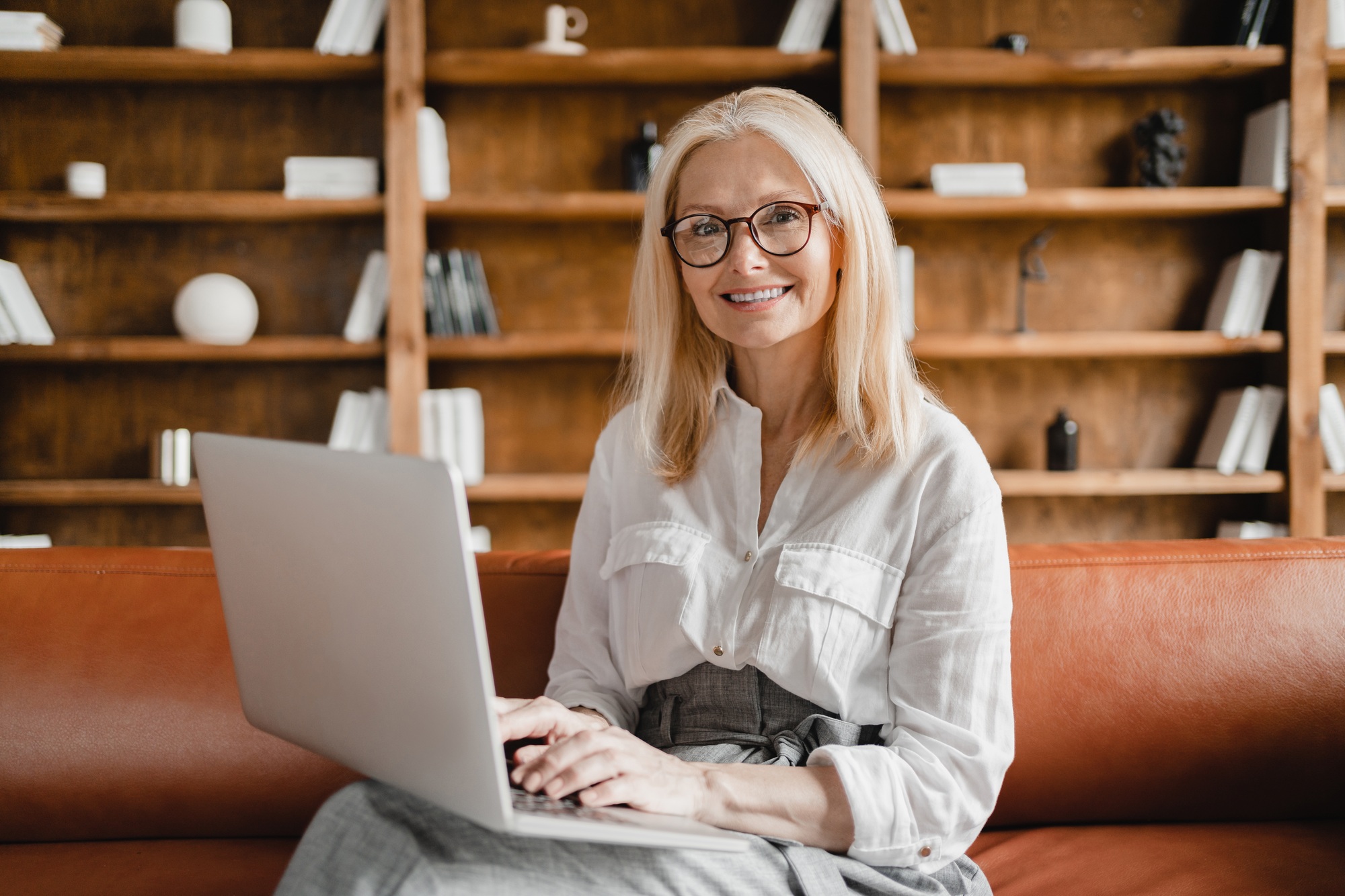 Businesswoman leader psychologist working on laptop listening to clients in office e-learning online