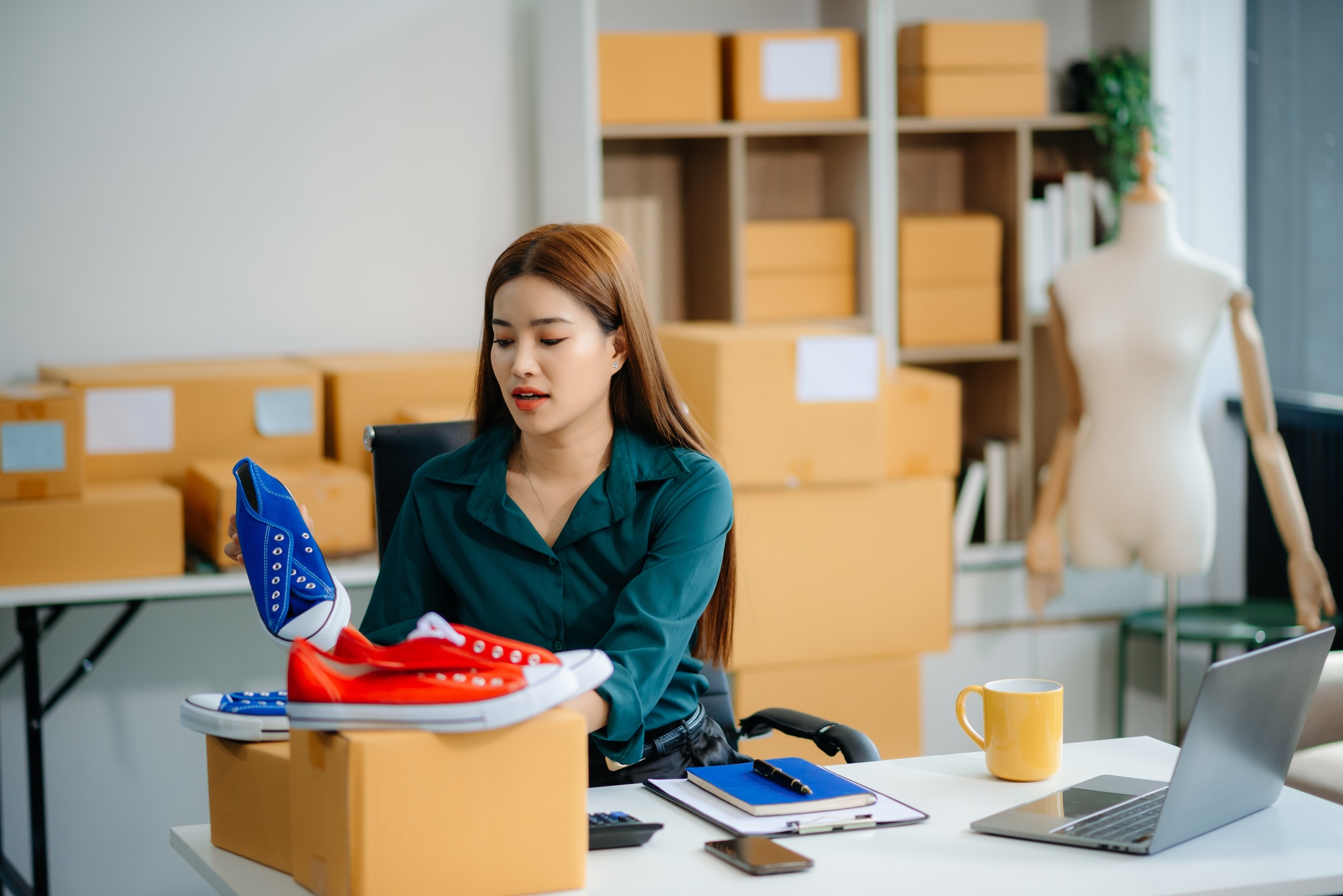 Businesswoman preparing product shipments. Highlighting creativity, entrepreneurship,
