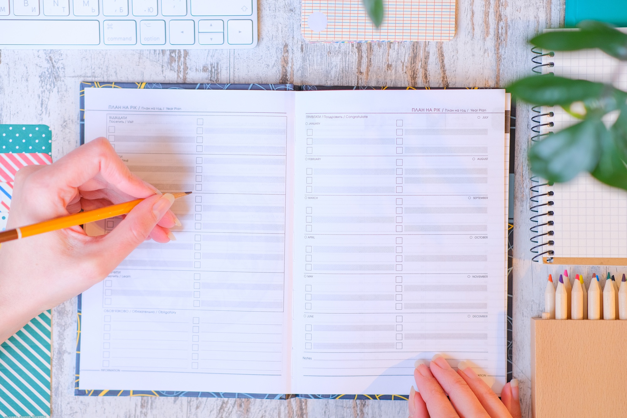 Calendar flat lay. Planning of the time. Year and months planner. Left-handed person.