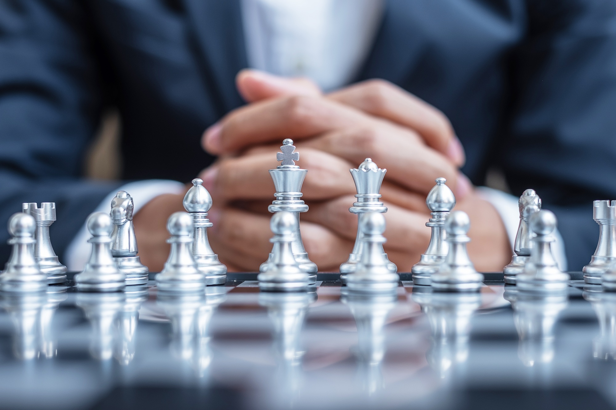 Chess figure on Chessboard against opponent or enemy. Strategy, Conflict, management