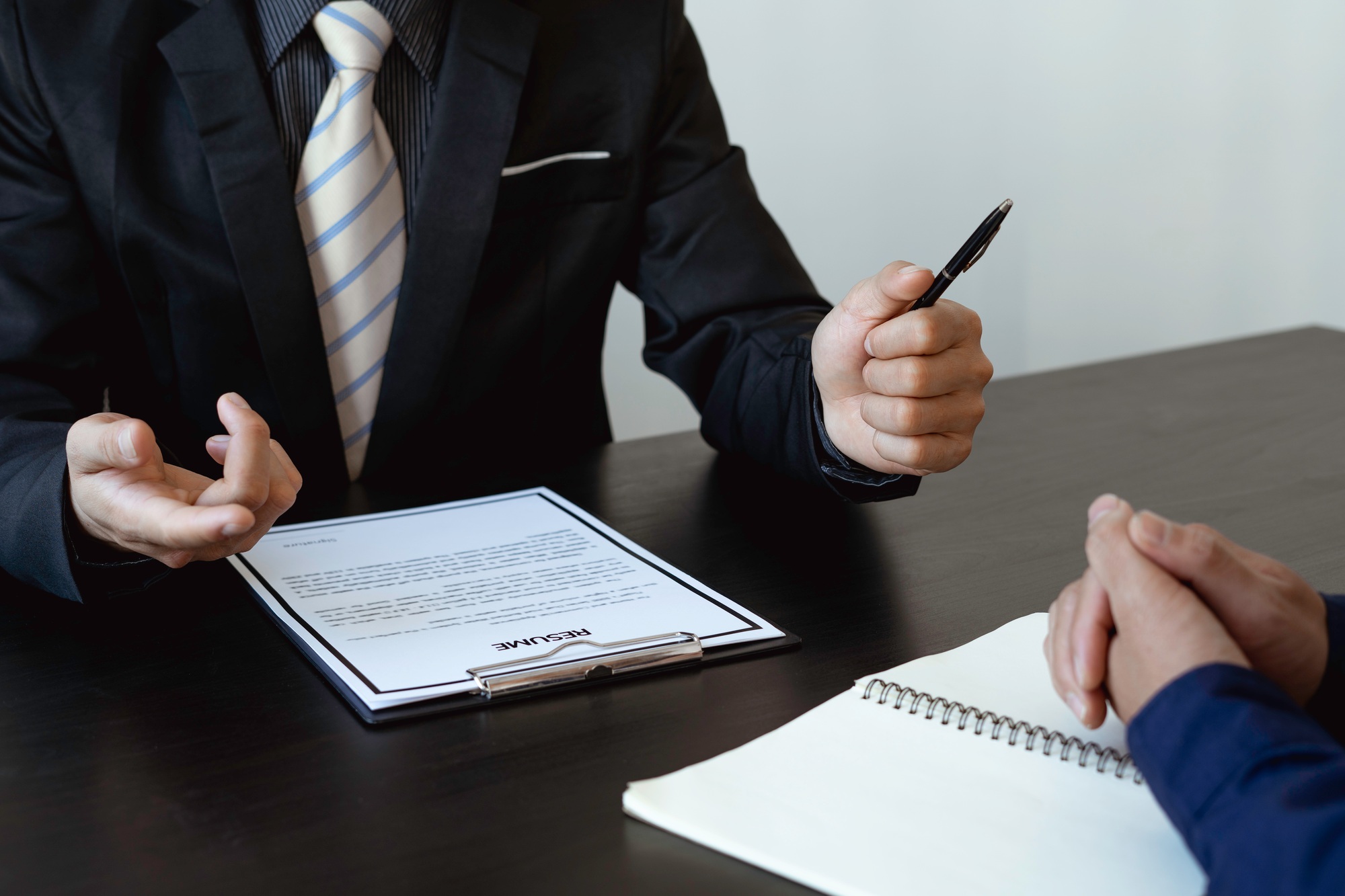Close up interviewer interview candidate apply for a job at the meeting room in the office. Image of