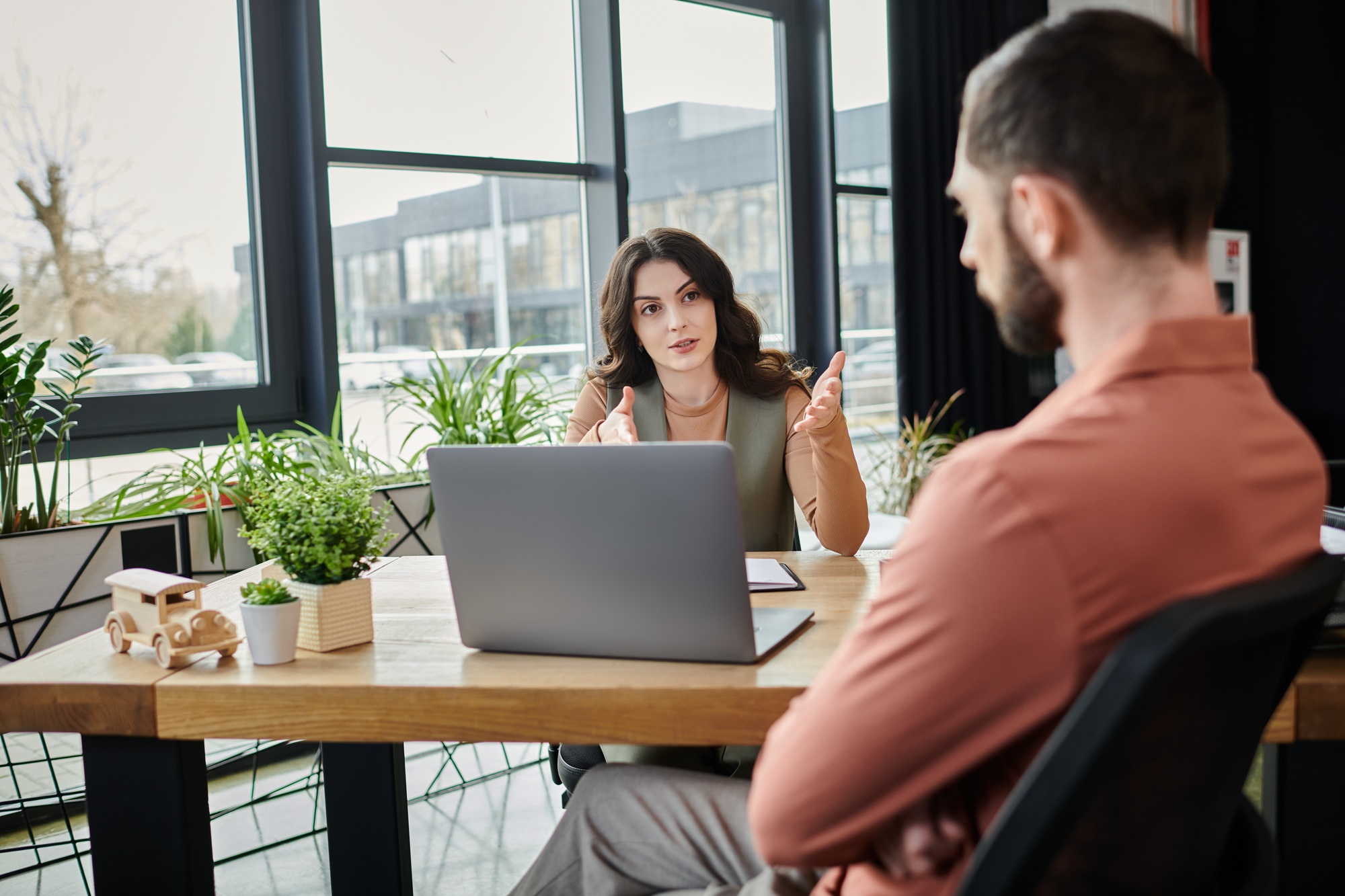 Colleagues Discuss Changes in Casual Elegant Attire During Employment Transition